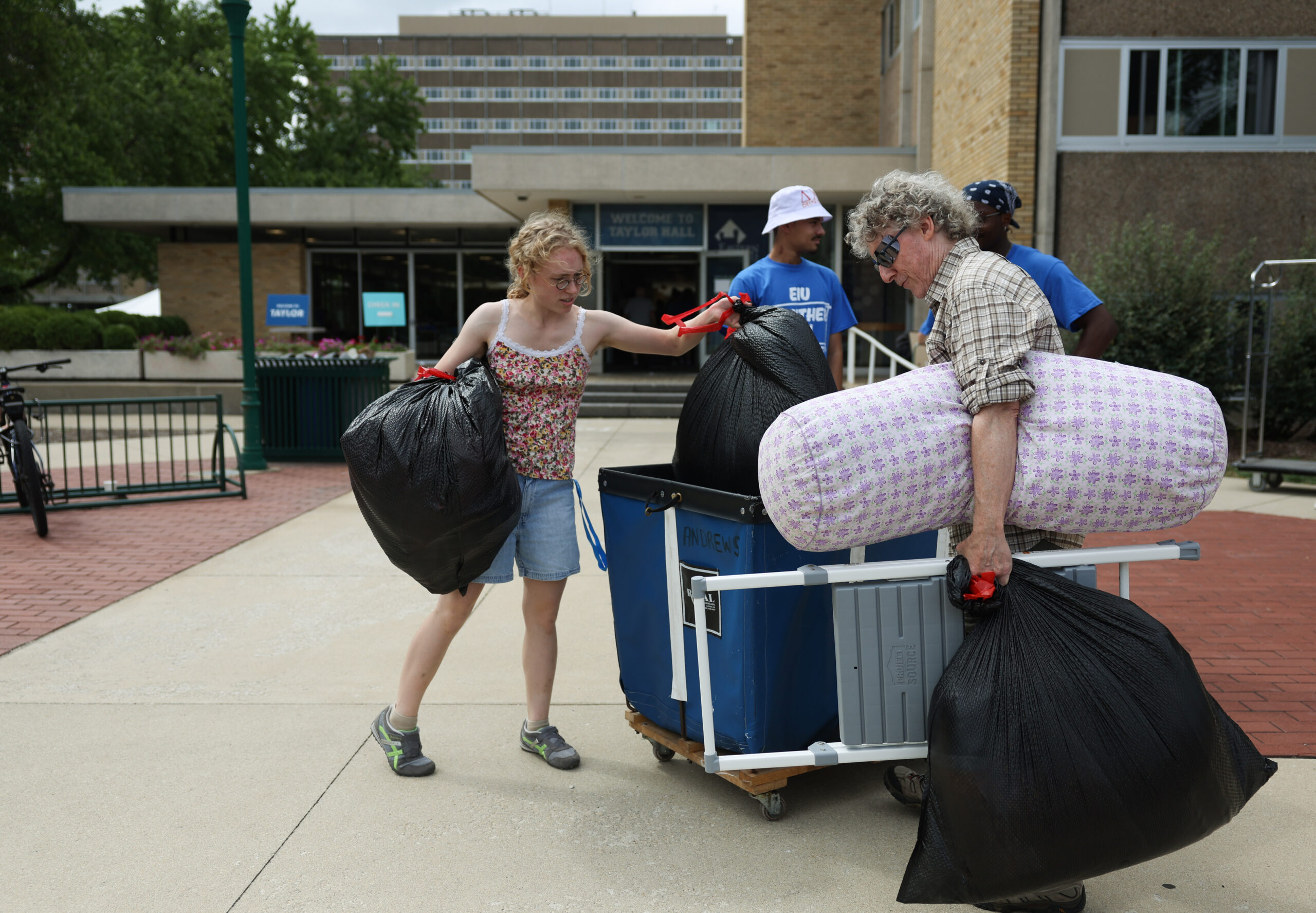 Esme Bryson and her father, Mike Bryson, of Joliet, move...