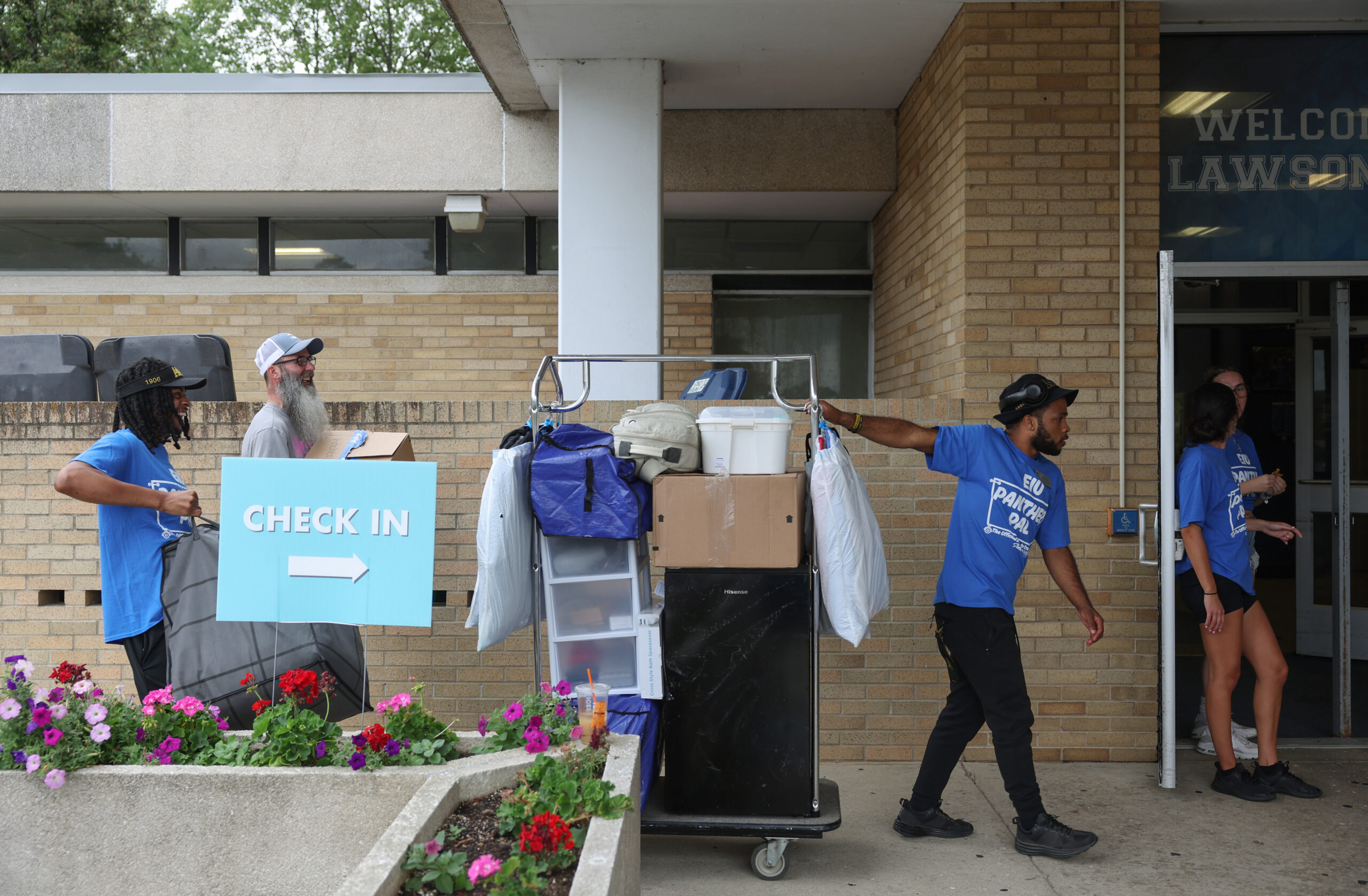 Eastern Illinois University senior Caleb Butler, center right, pulls a...