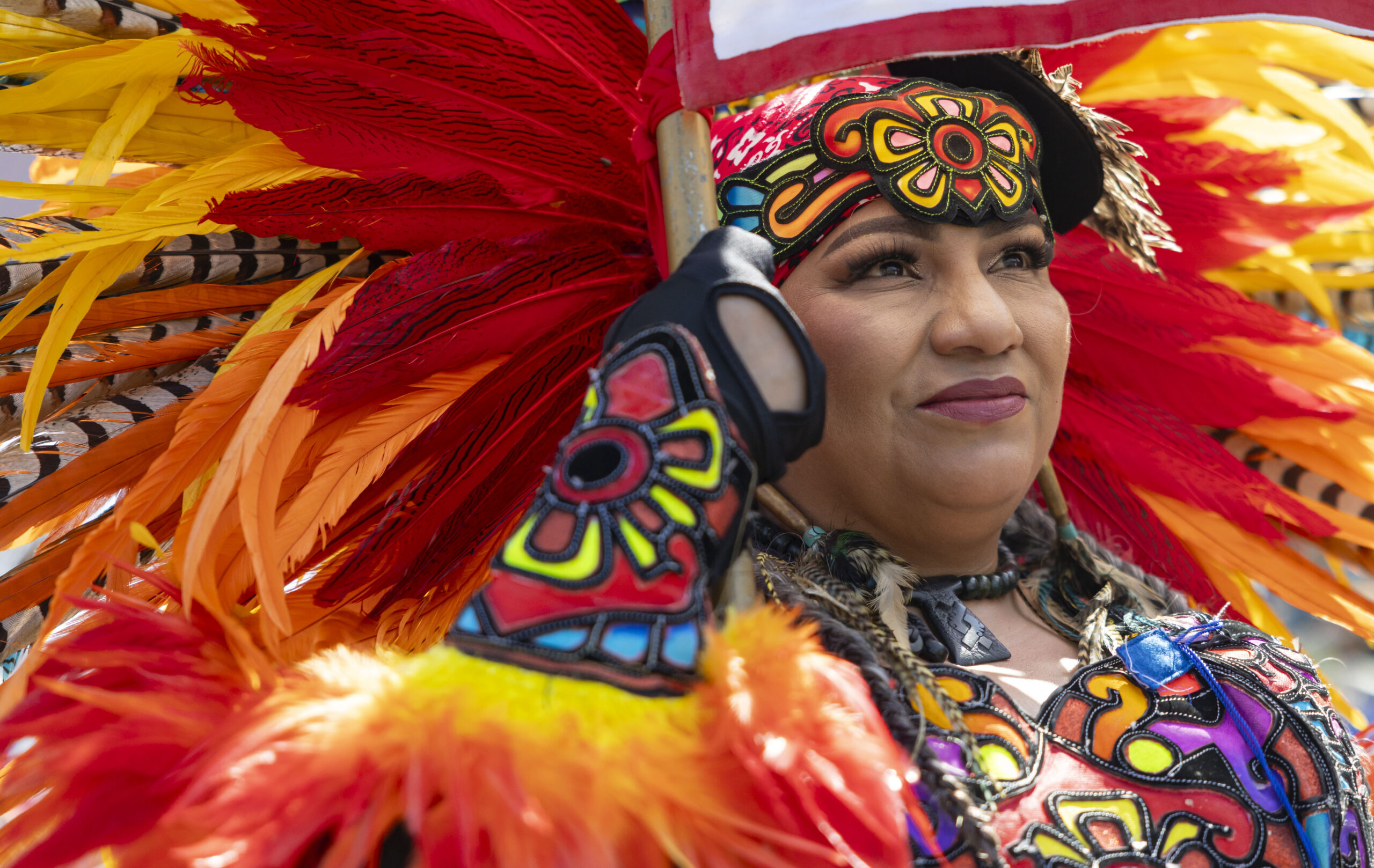 Aztec dancers prepare to march in the annual 26th Street...
