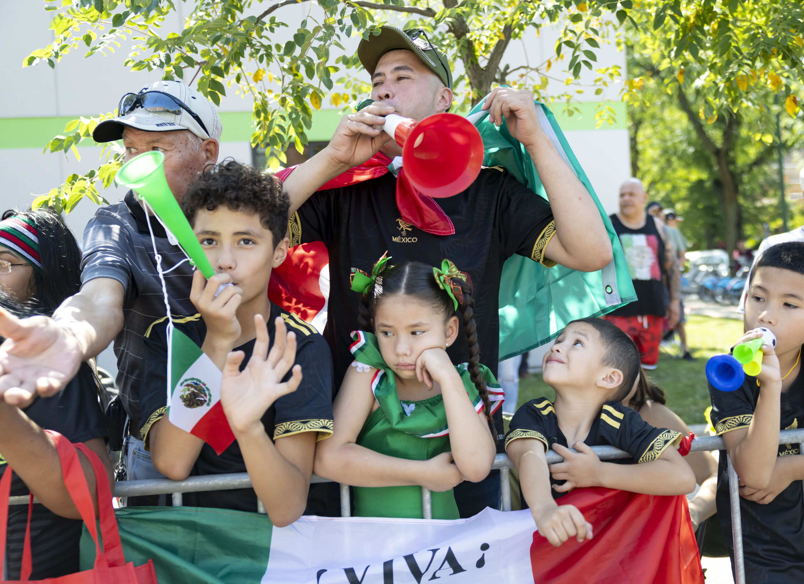 People watch and cheer during the annual 26th Street Mexican...