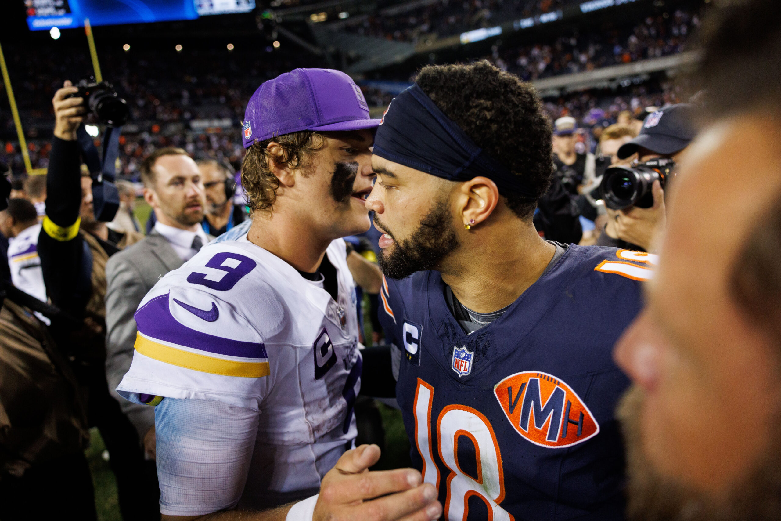 Vikings quarterback J.J. McCarthy hugs Bears quarterback Caleb Williams after...