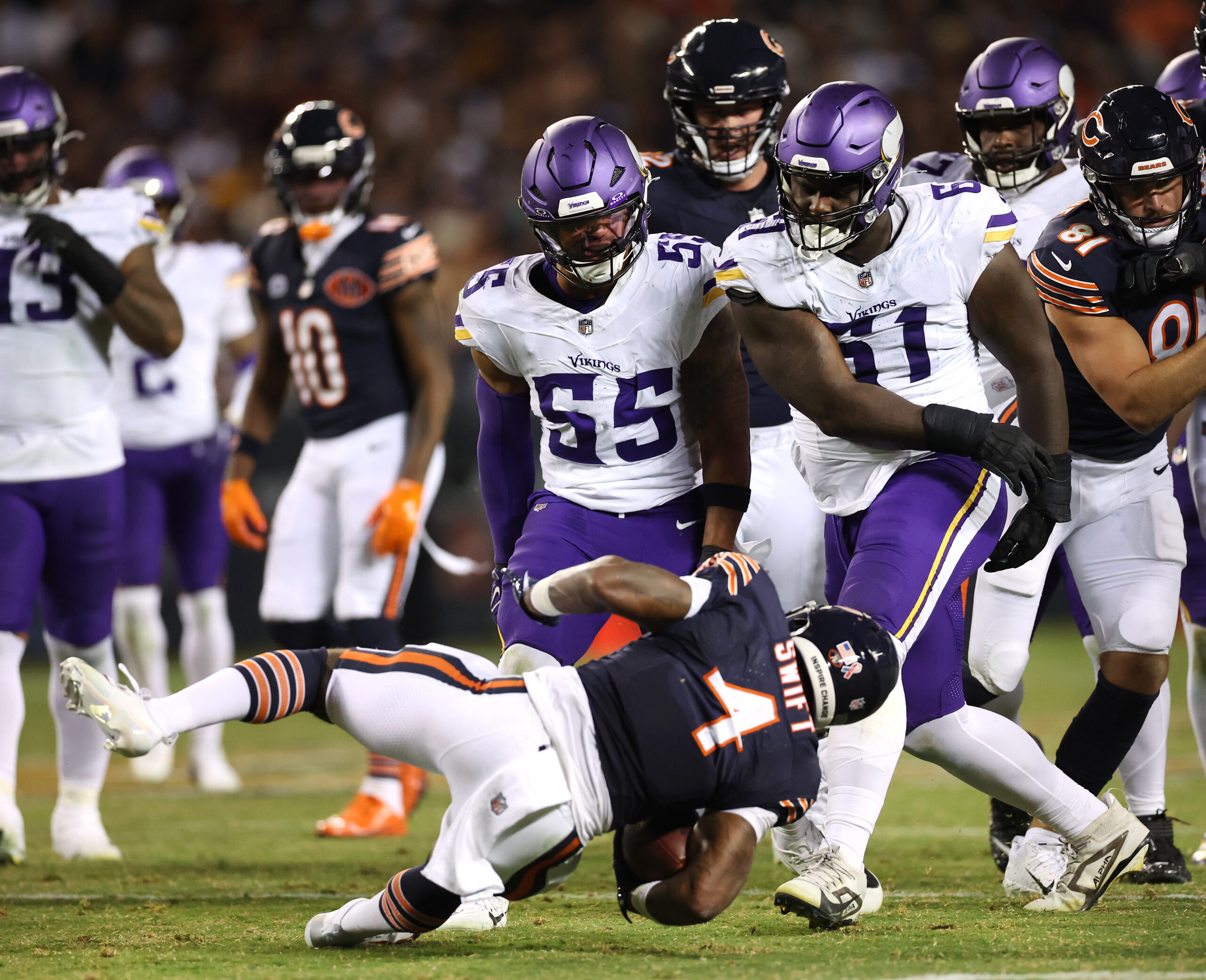 Minnesota Vikings defensive tackle Jalen Redmond (61) throws Chicago Bears...