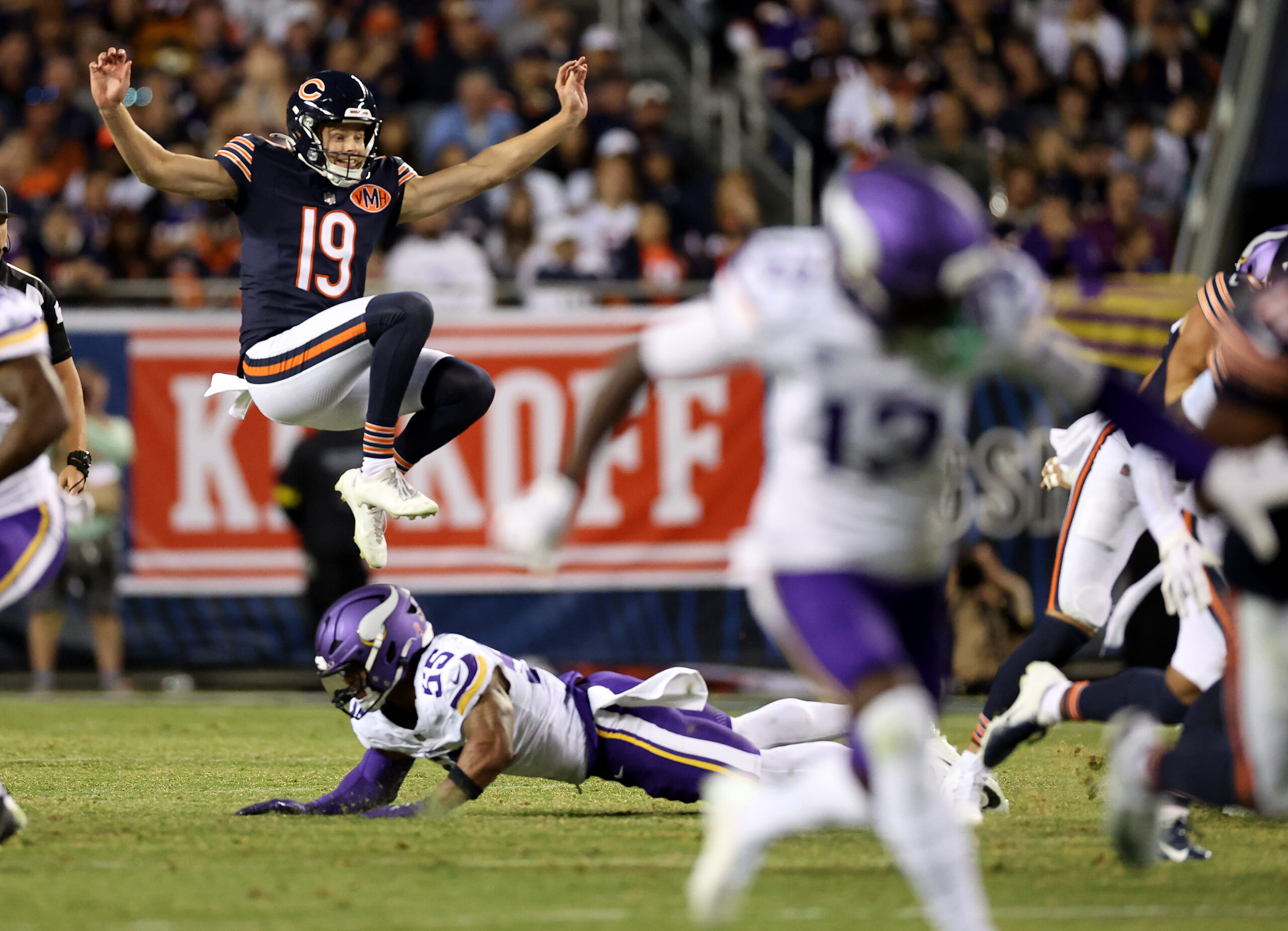 Chicago Bears punter Tory Taylor (19) jumps over a Minnesota...