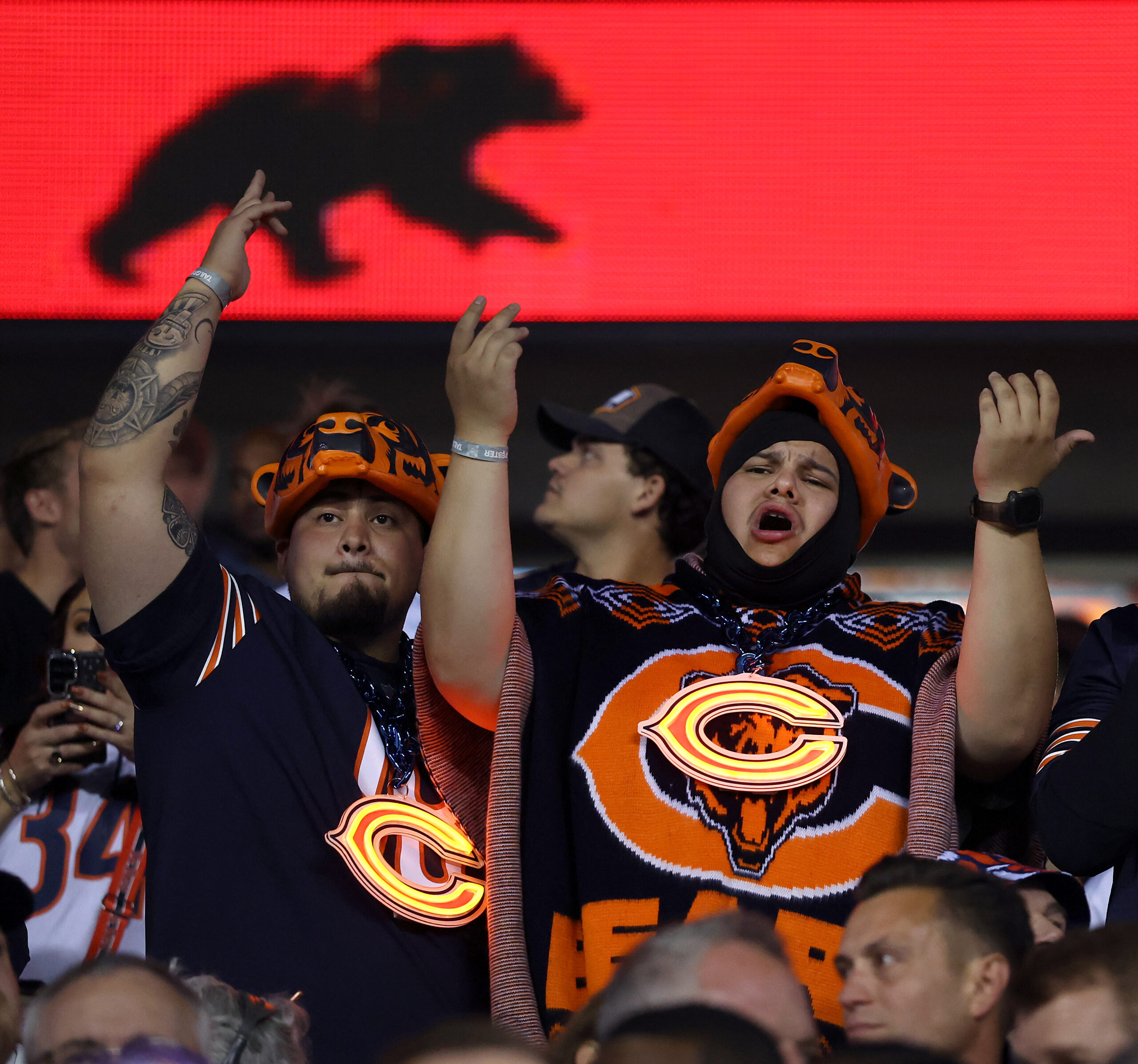 Chicago Bears fans try to motivate their team in the...