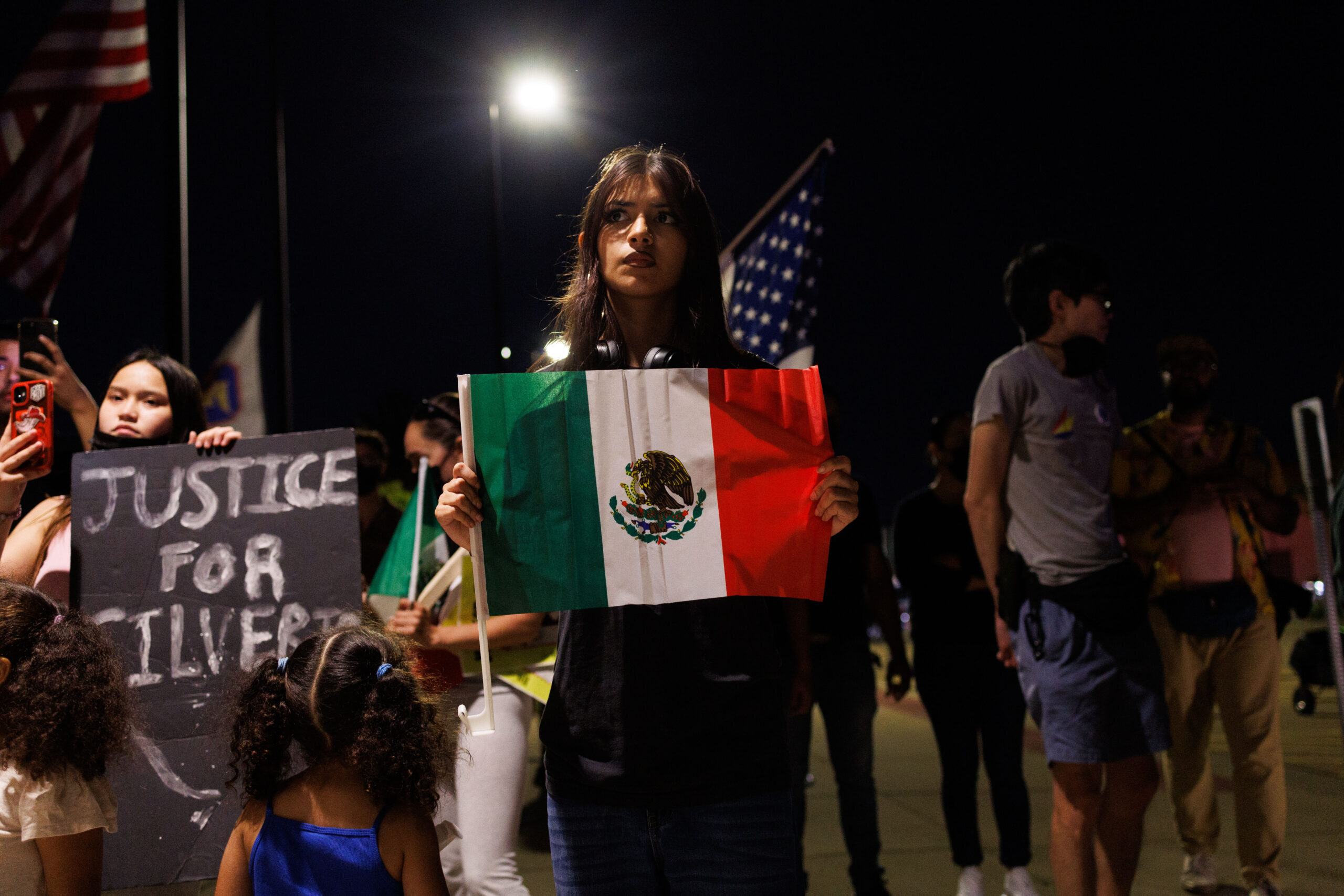 People gather outside the Village of Franklin Park police station,...