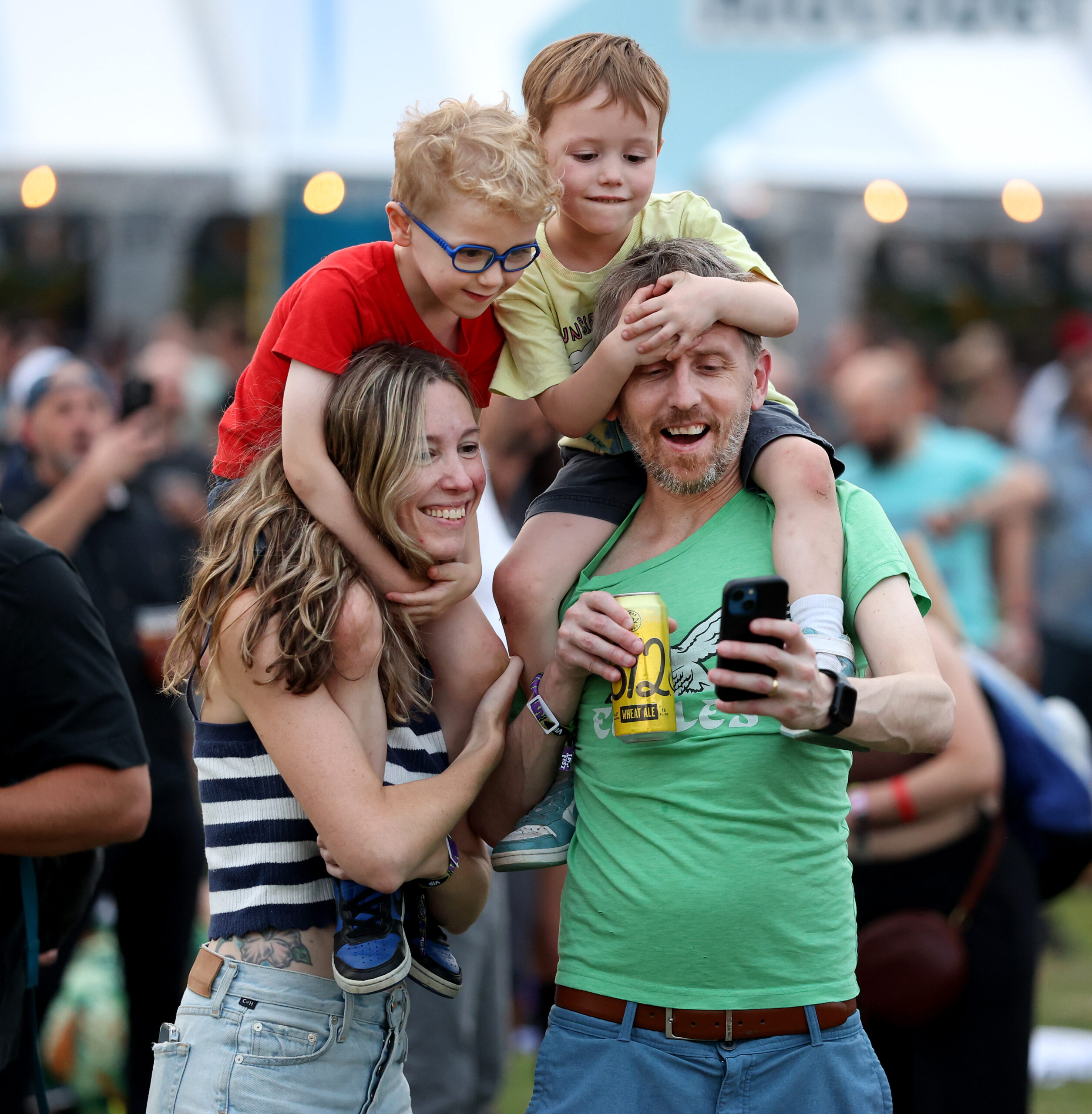 A family makes a portrait while attending Riot Fest in...