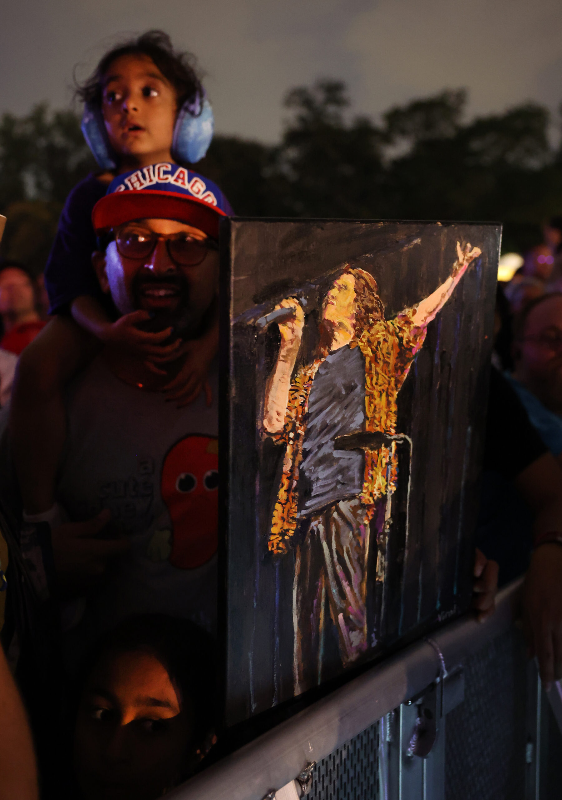 Fans take in a performance by “Weird Al” Yankovic while...