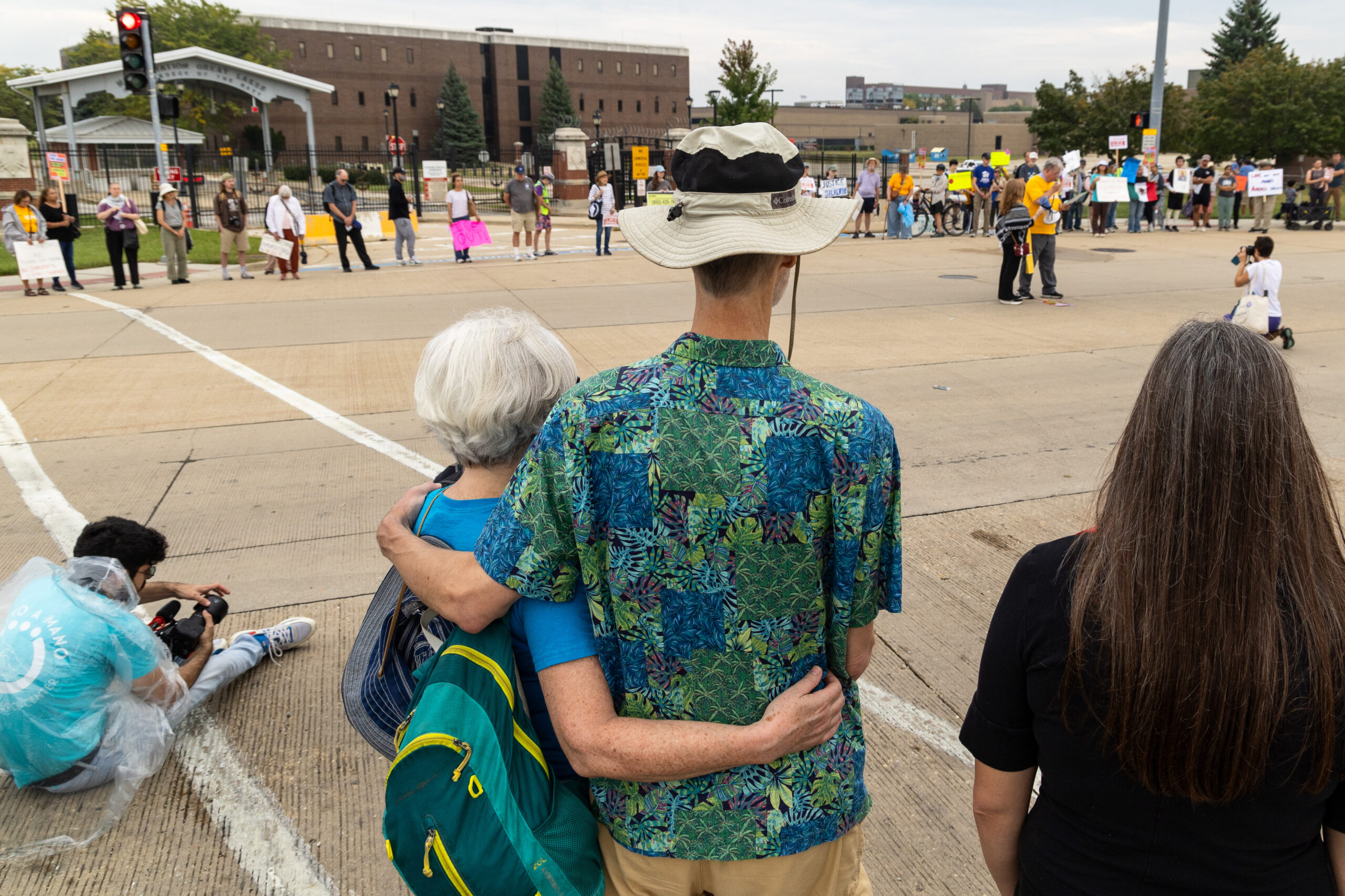 Pam, left, and Kevin Horan-Bussey of West Ridge embrace while...
