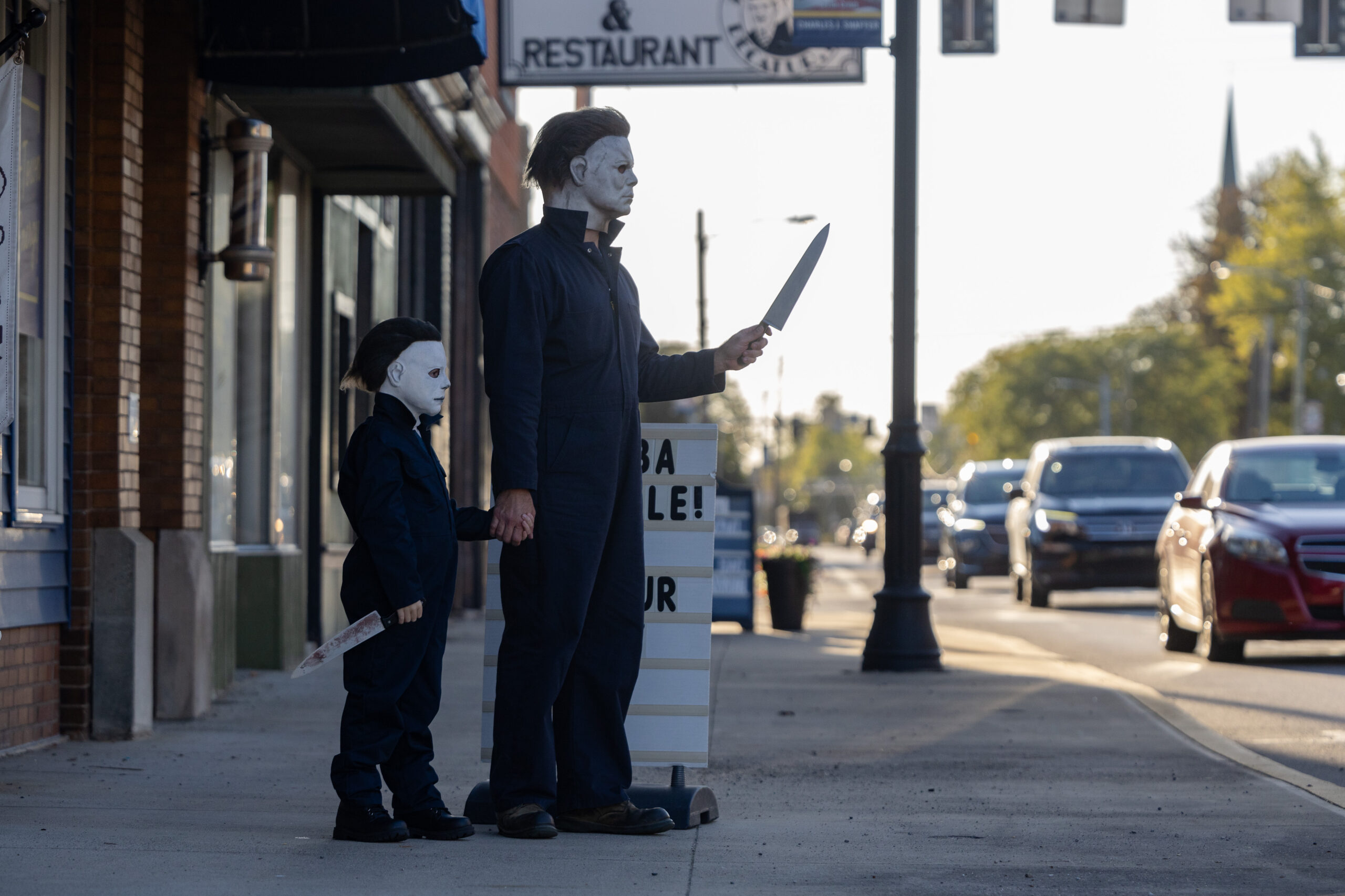 Evan Zimmerman, left, and his son Harrison Zimmerman, 7, stare...