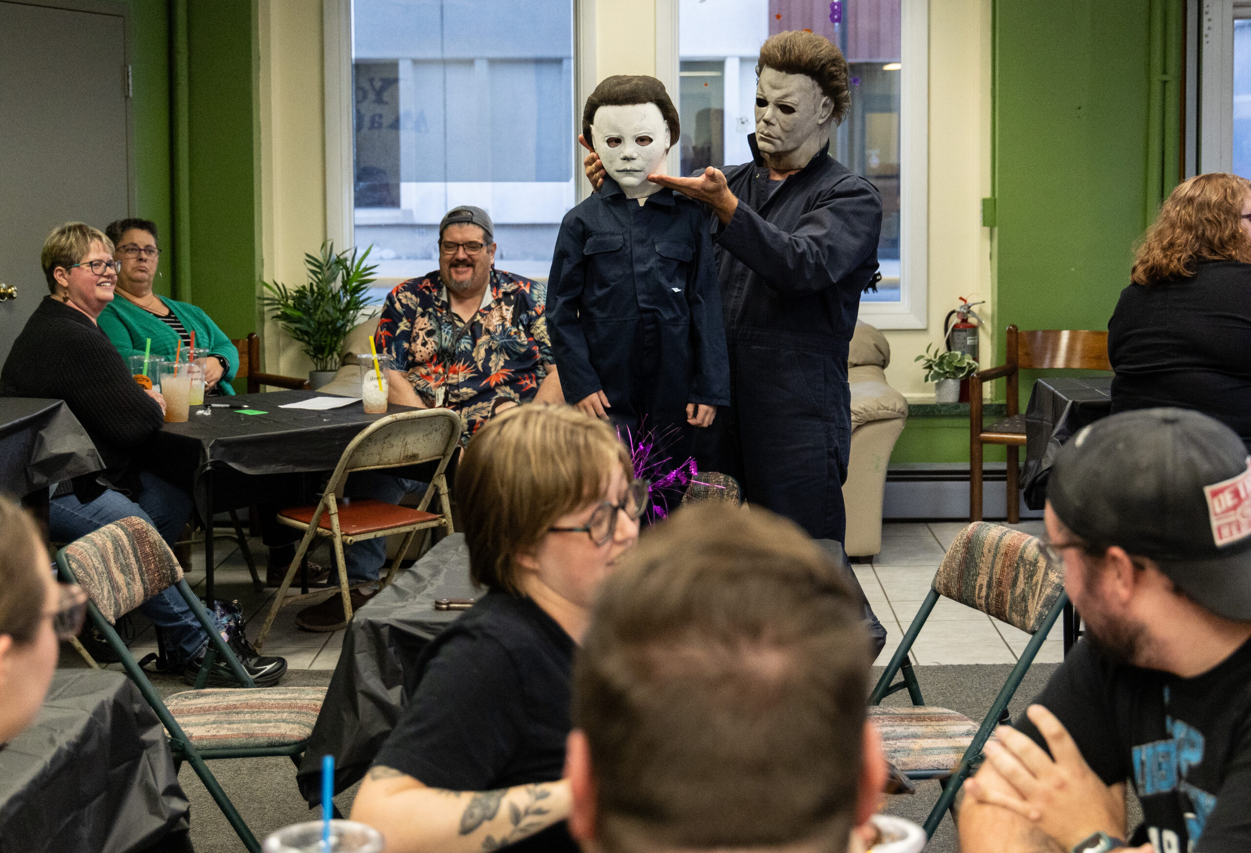 Evan Zimmerman, right, shows off his son Harrison's Michael Myers...