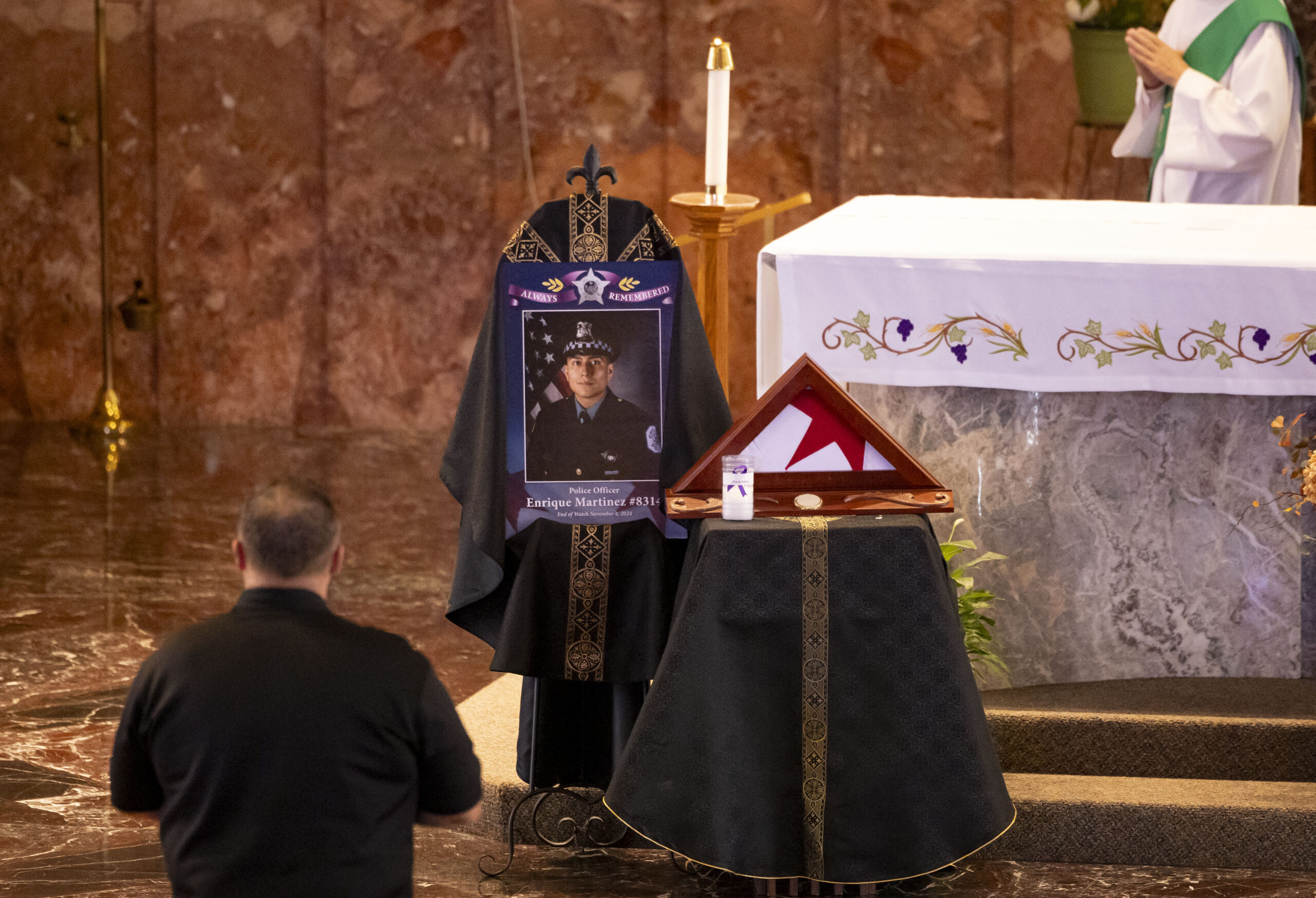 A photo is displayed during a Mass dedicated to slain...