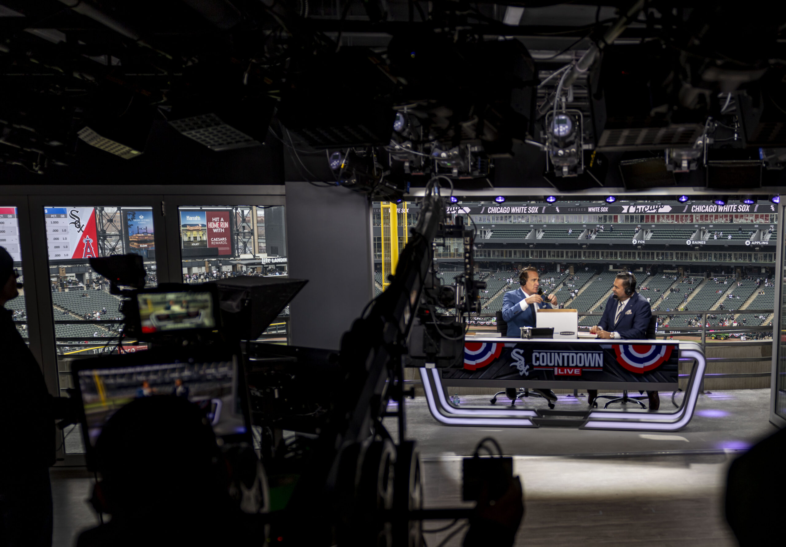 Chicago Sports Network hosts Chuck Garfien and Ozzie Guillen broadcast...