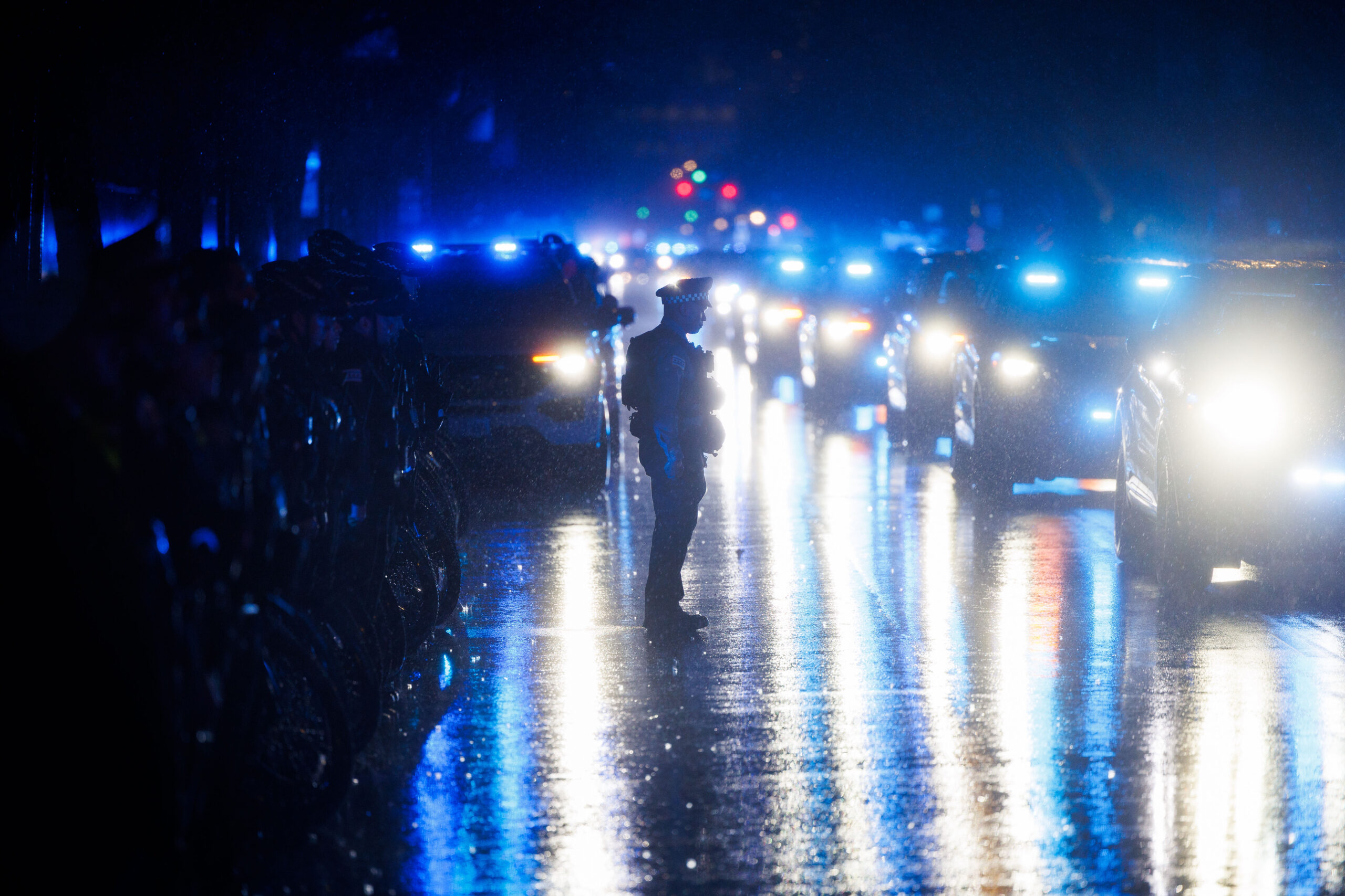 Members of the Chicago fire and police departments stand in...