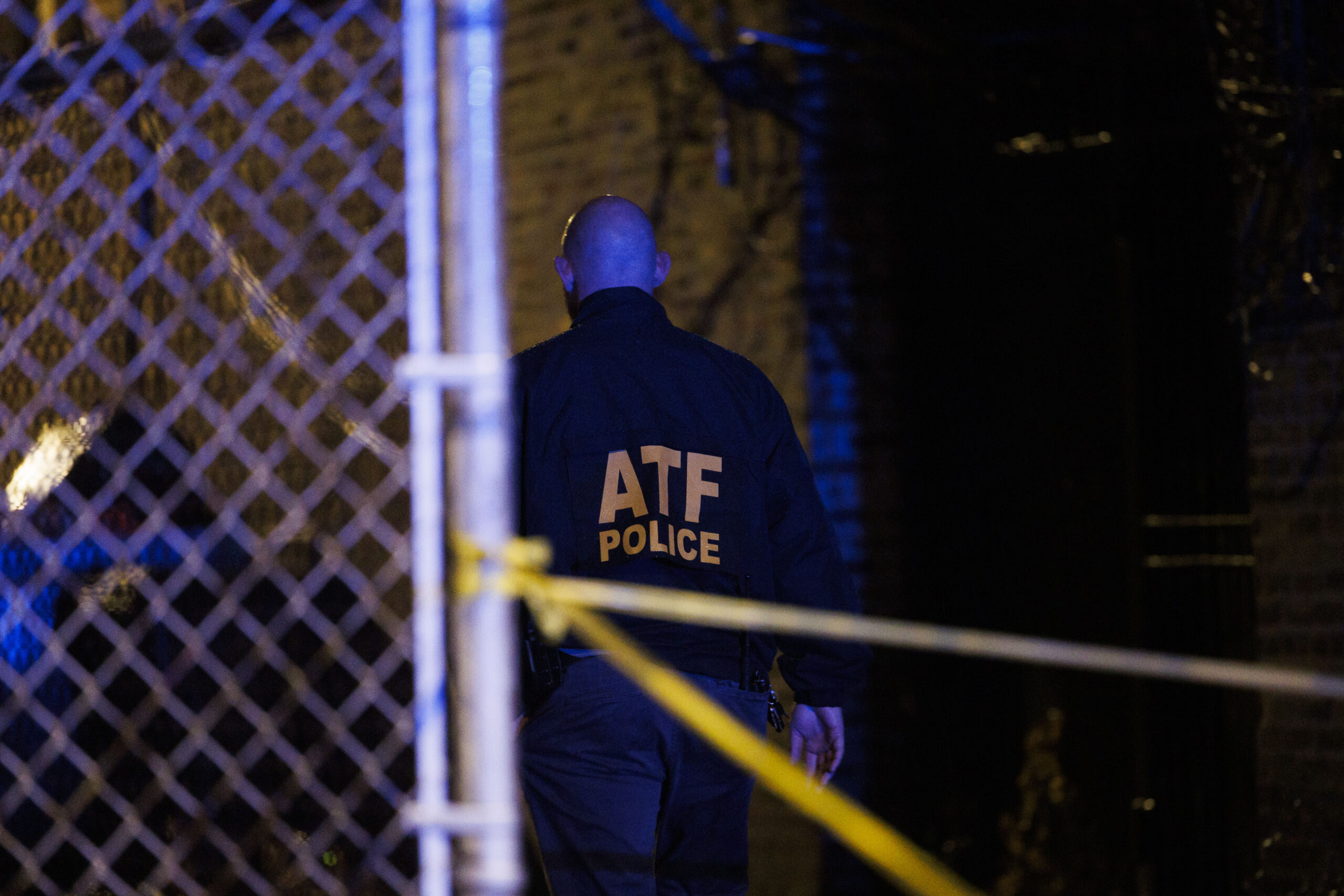 Federal agents work at the scene where Chicago police Officer...