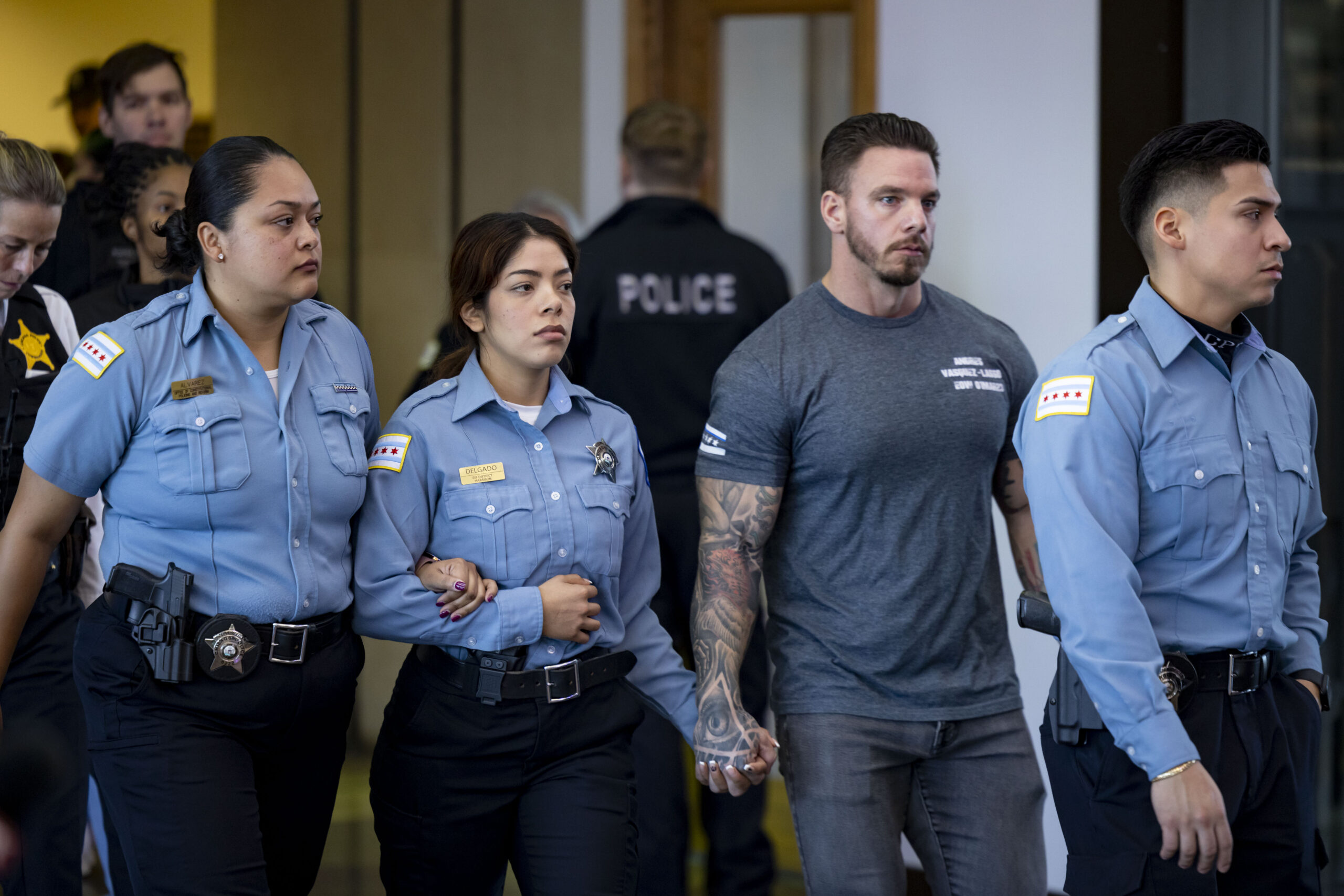 Chicago police officers depart after a hearing on Nov. 7,...