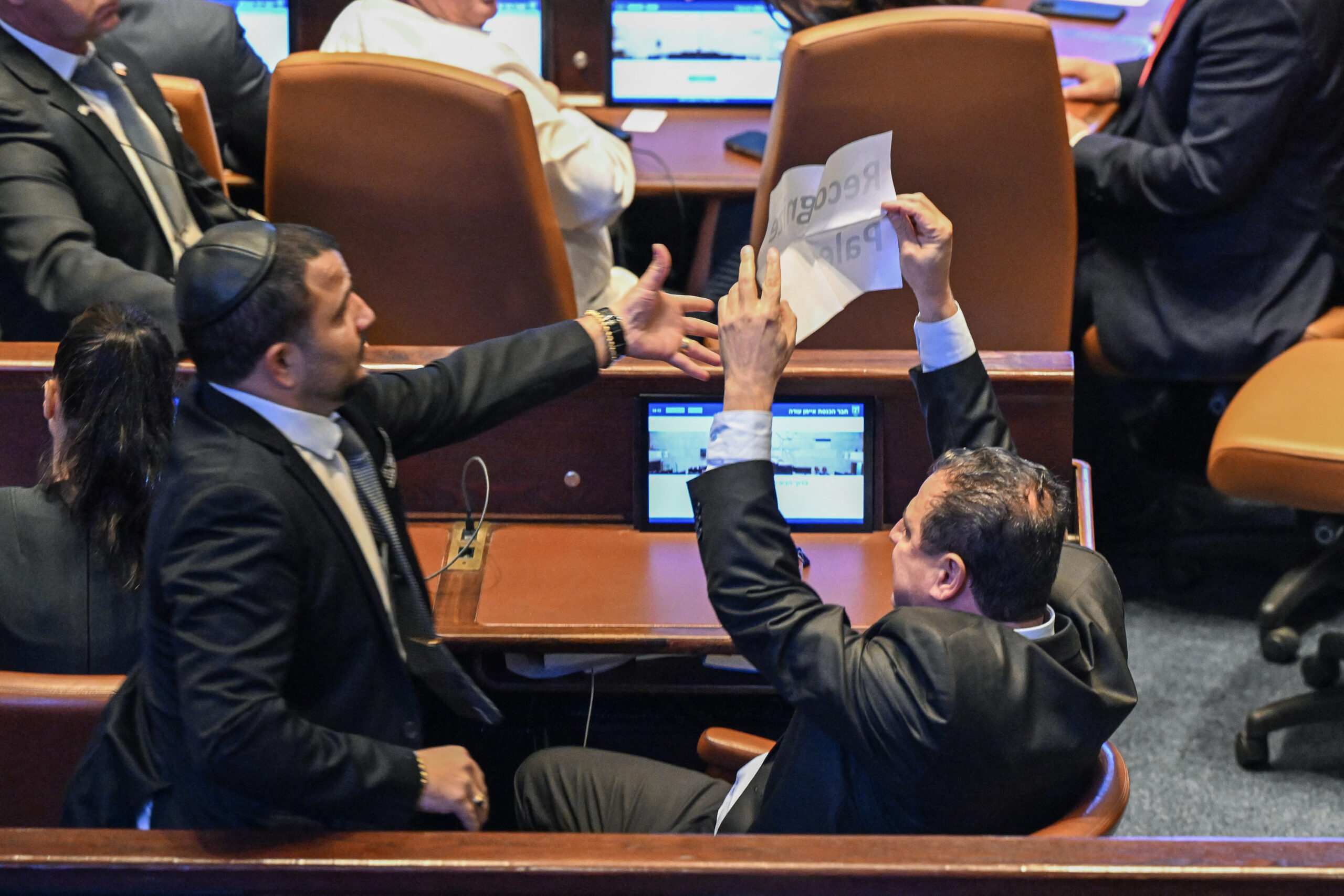 Ayman Odeh, a member of the Israeli Knesset, holds a...