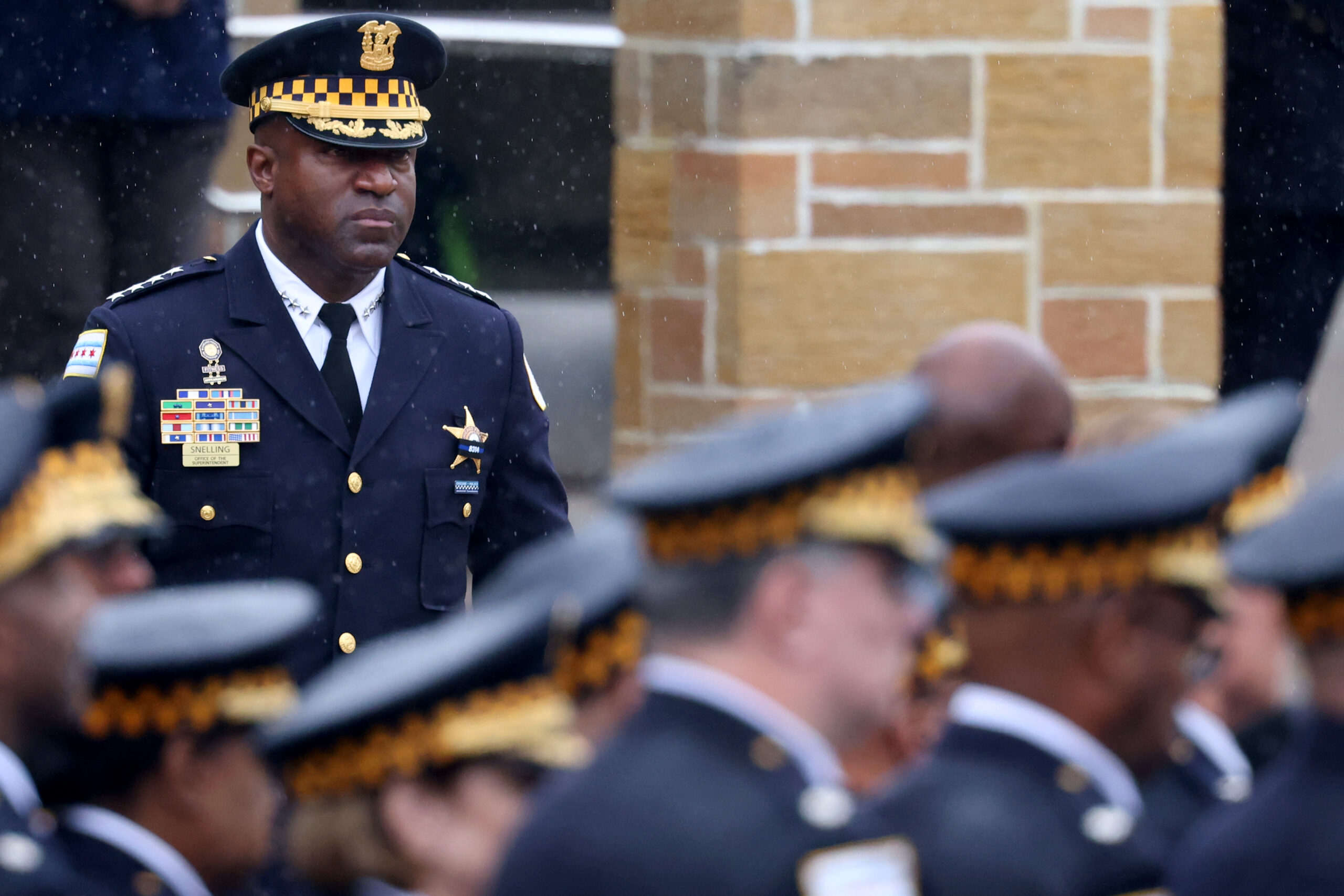 Police Superintendent Larry Snelling leaves the church following funeral services...
