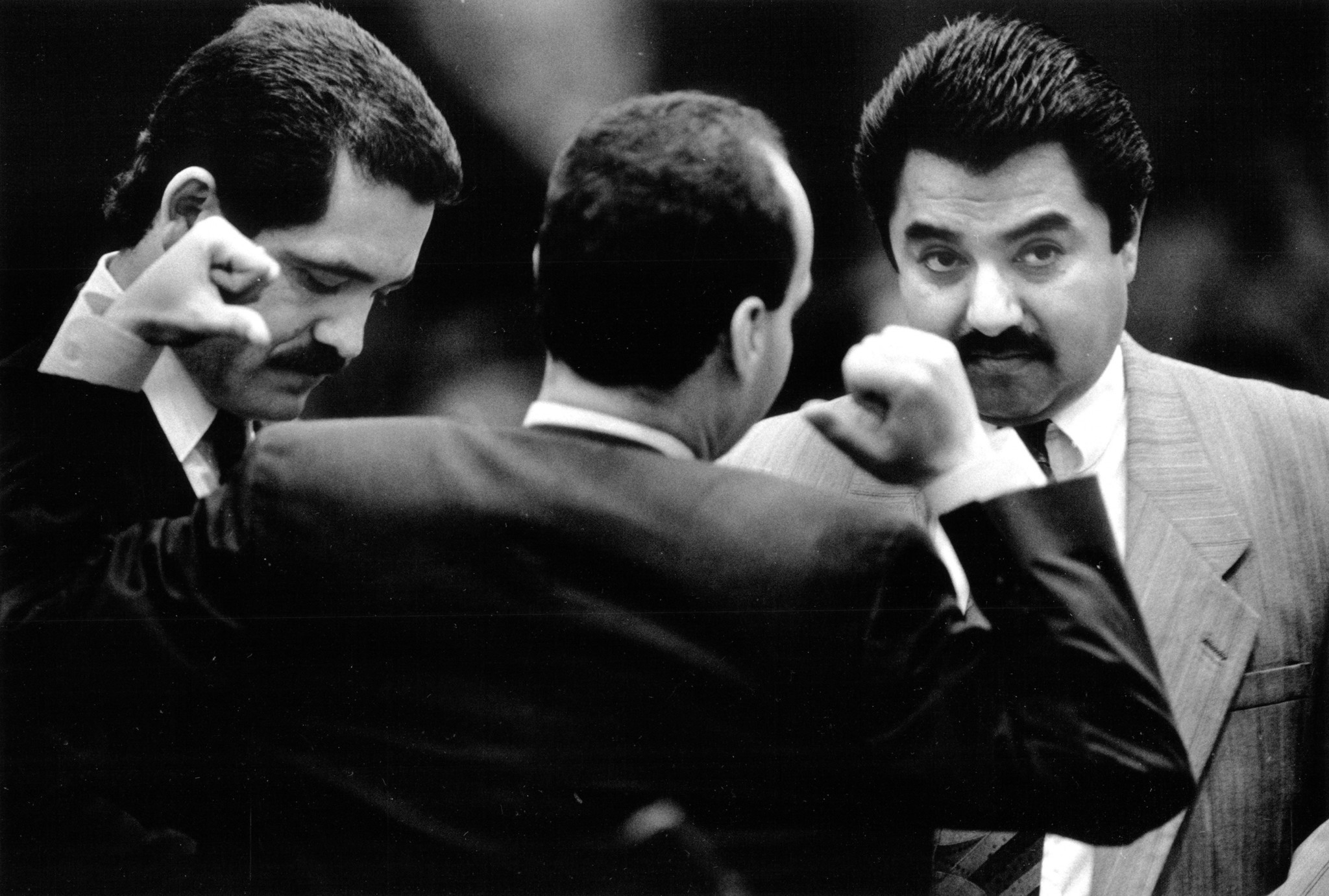 Ald. Luis Gutierrez, 26th, stretches while talking to Ald. Jesus...