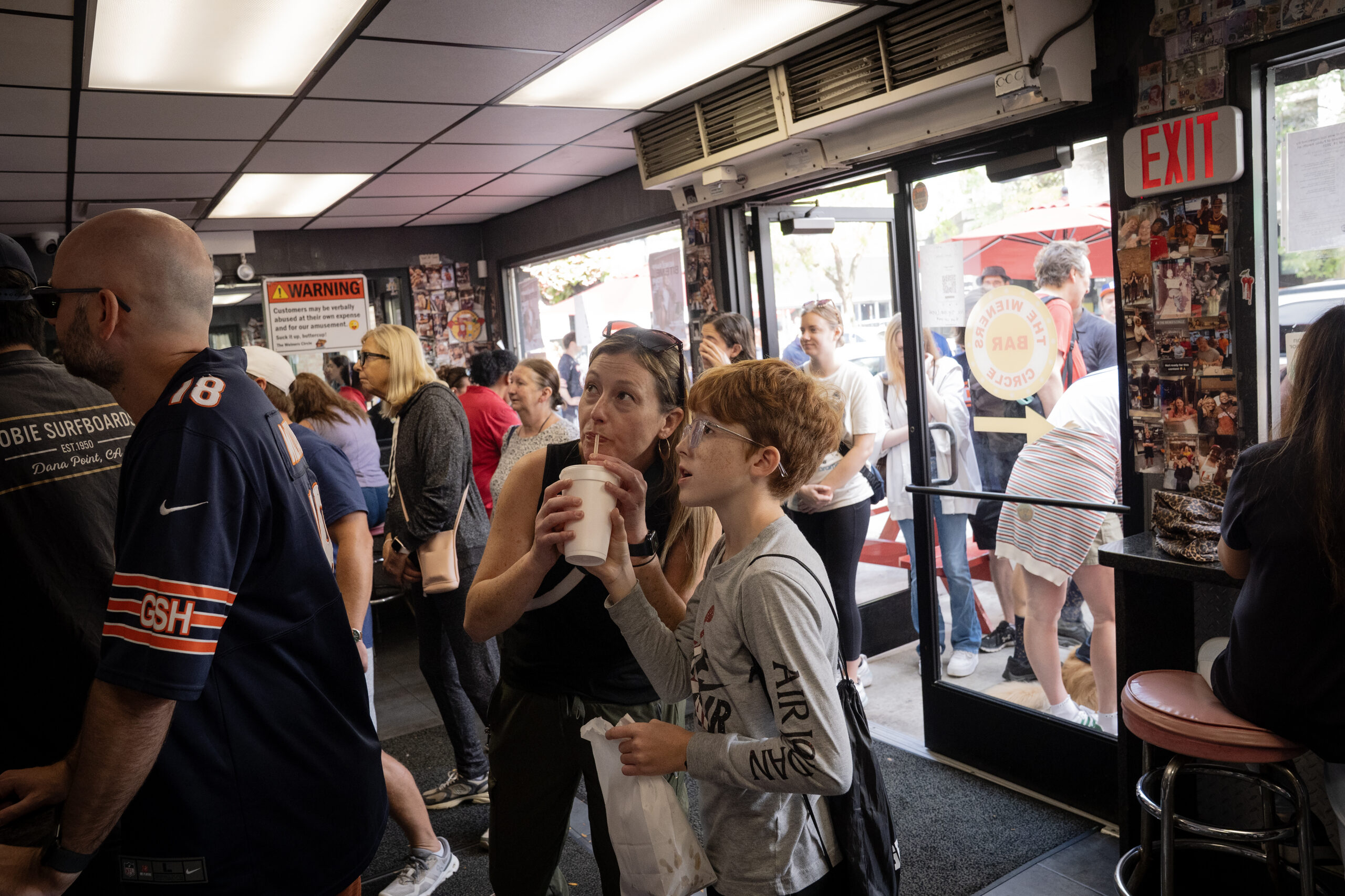 A crowd of Bears fans and hot dog fans mob...