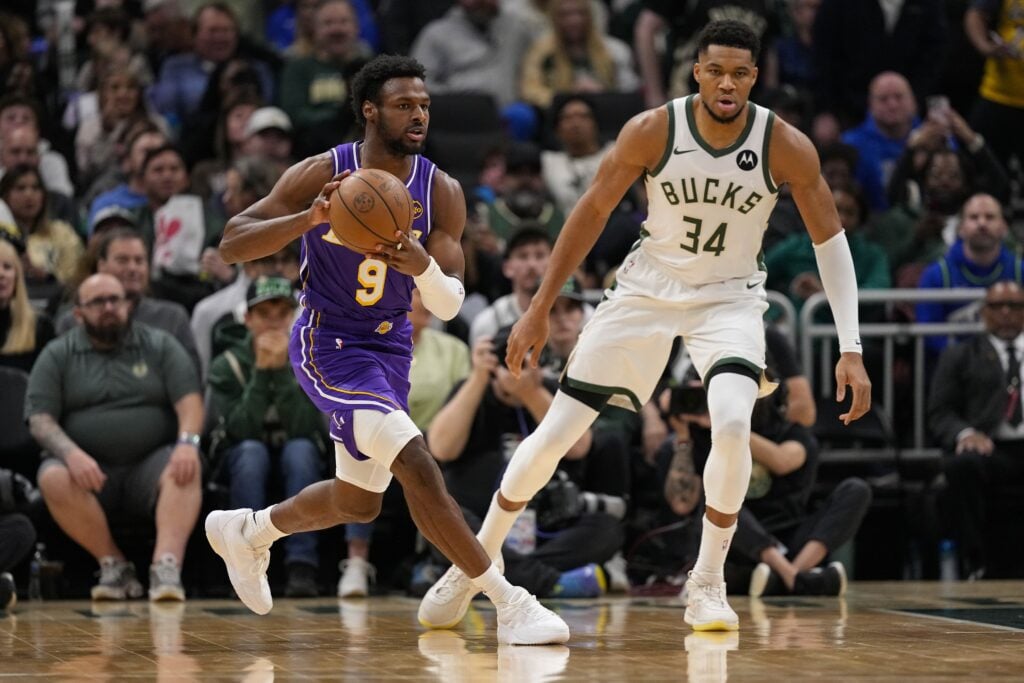 Nov 15, 2025; Milwaukee, Wisconsin, USA; Los Angeles Lakers guard Bronny James Jr. (9) passes the ball away during the first quarter against the Milwaukee Bucks at Fiserv Forum. Mandatory Credit: Jeff Hanisch-Imagn Images
