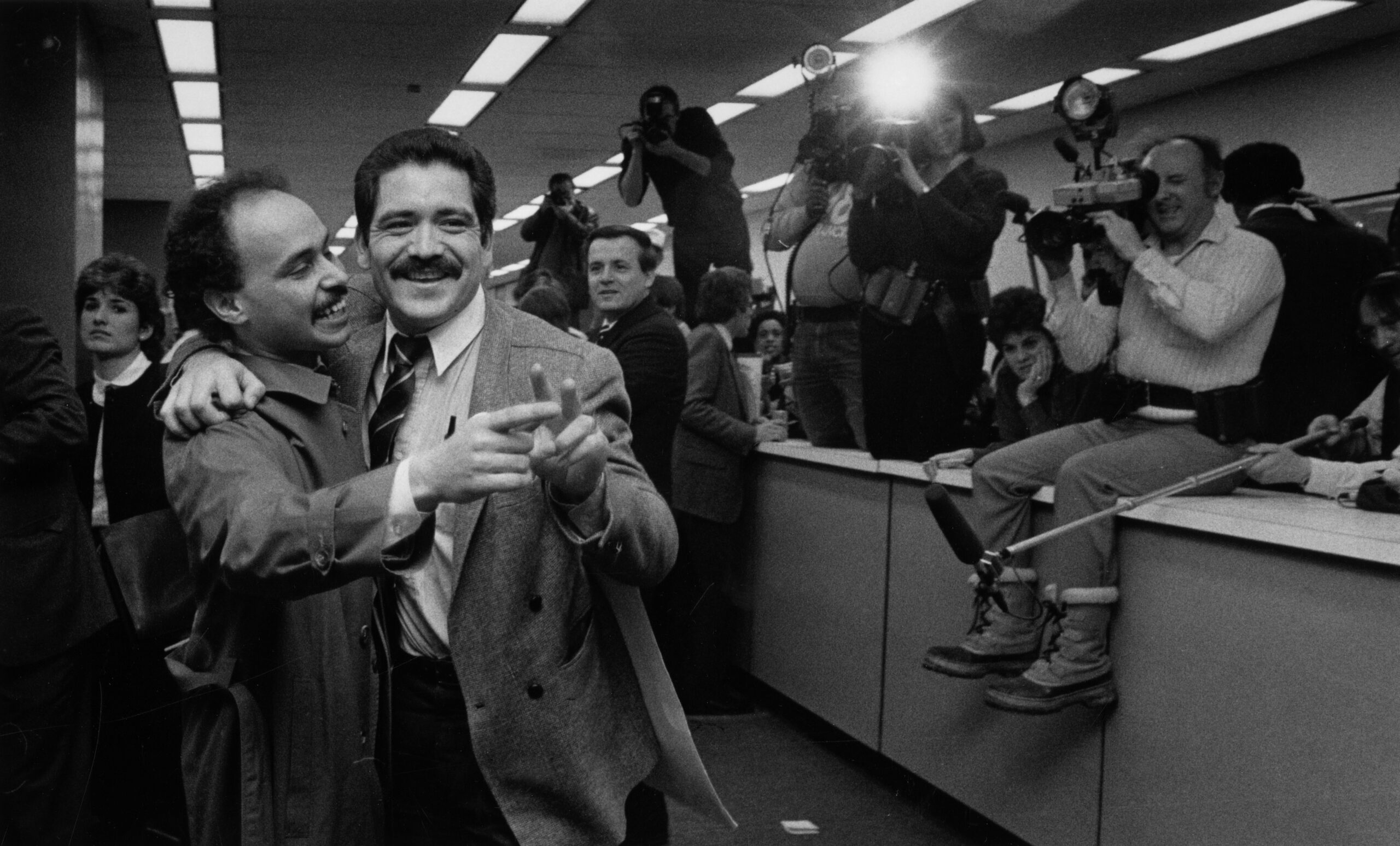 Both claiming victory, Luis Gutierrez, left, and Jesús “Chuy” García celebrate as...