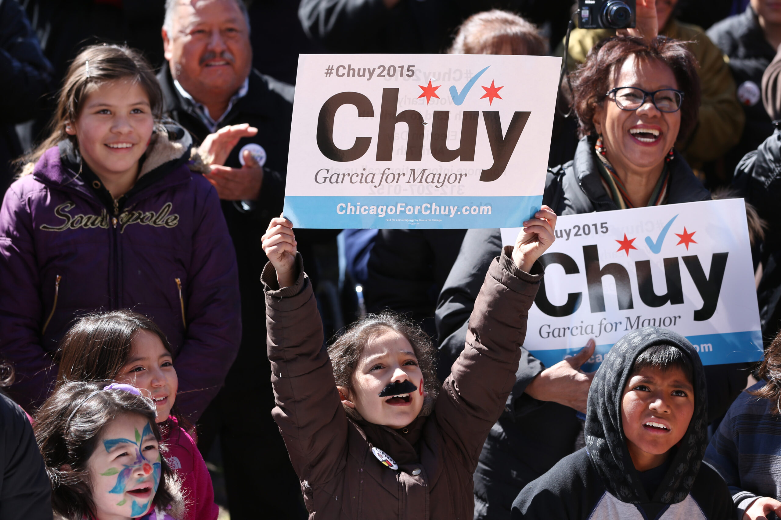 A young supporter of Chicago mayoral candidate Jesús “Chuy” García wears a...
