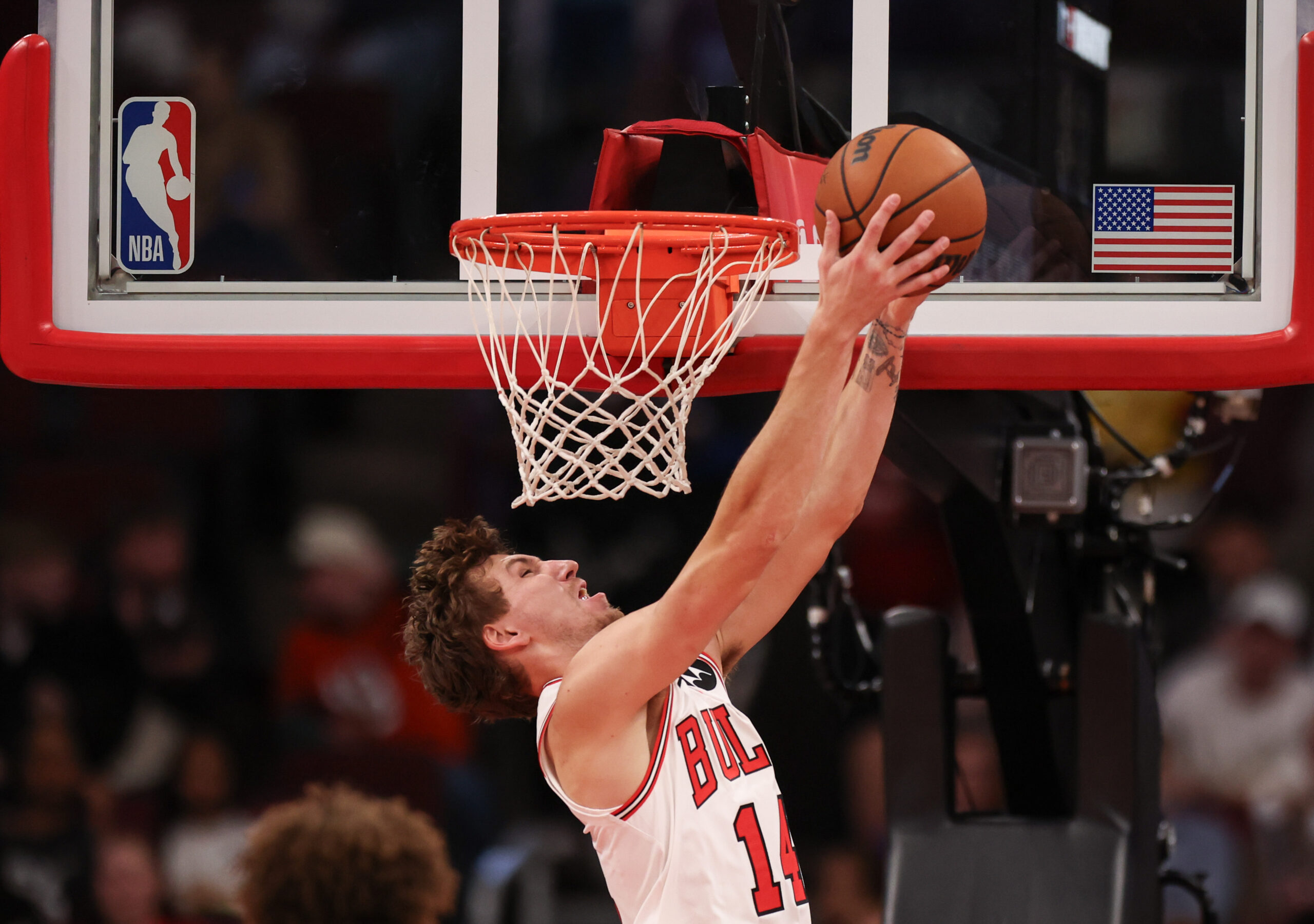 Chicago Bulls forward Matas Buzelis (14) dunks the ball in...