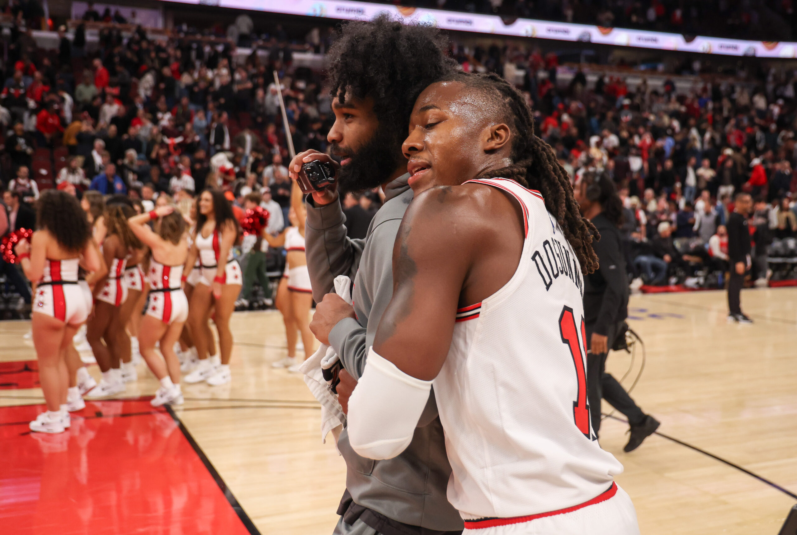 Chicago Bulls guard Ayo Dosunmu (11) hugs Chicago Bulls guard...