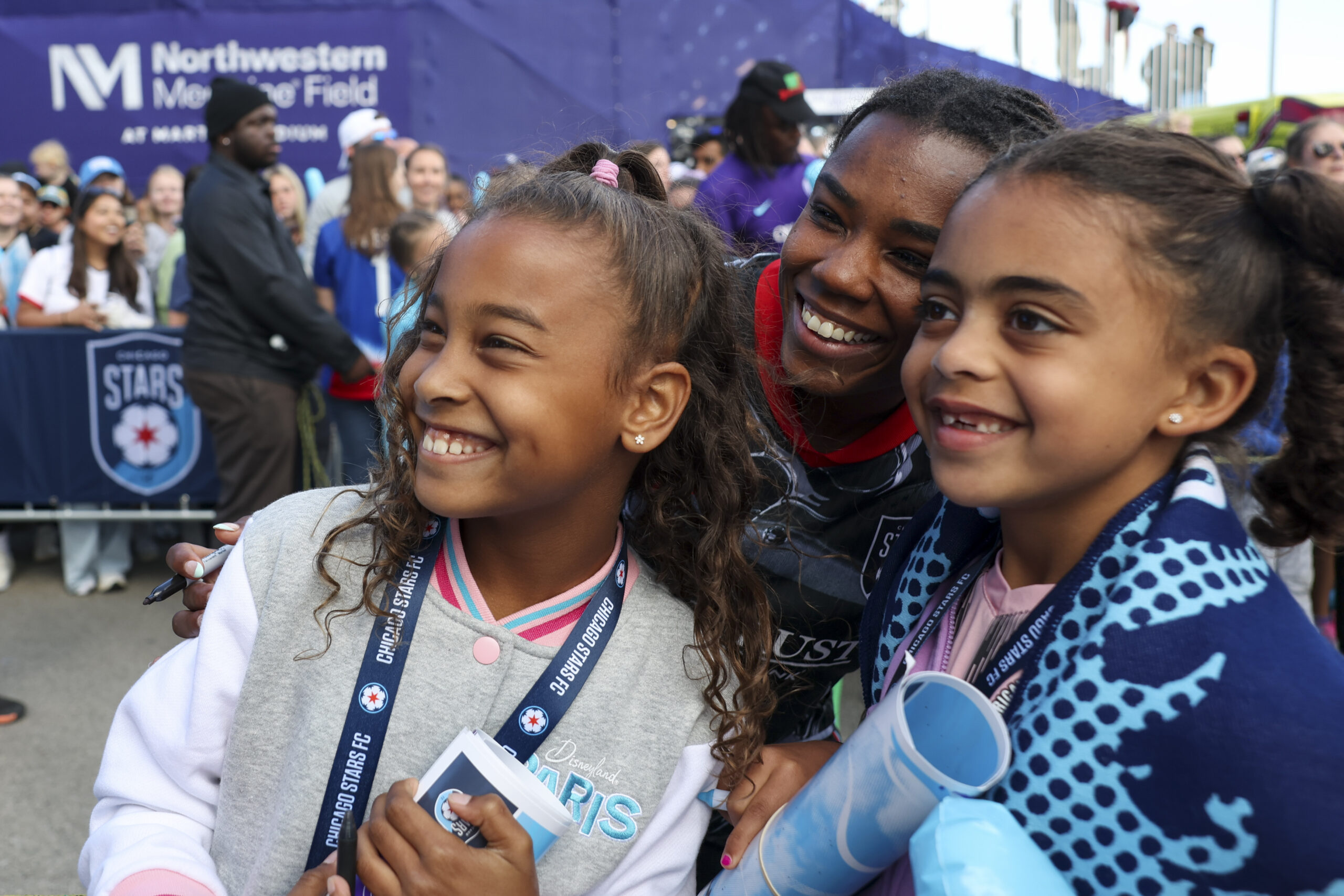 Chicago StarsÂ forward Ludmila (14) poses for a photo with young...