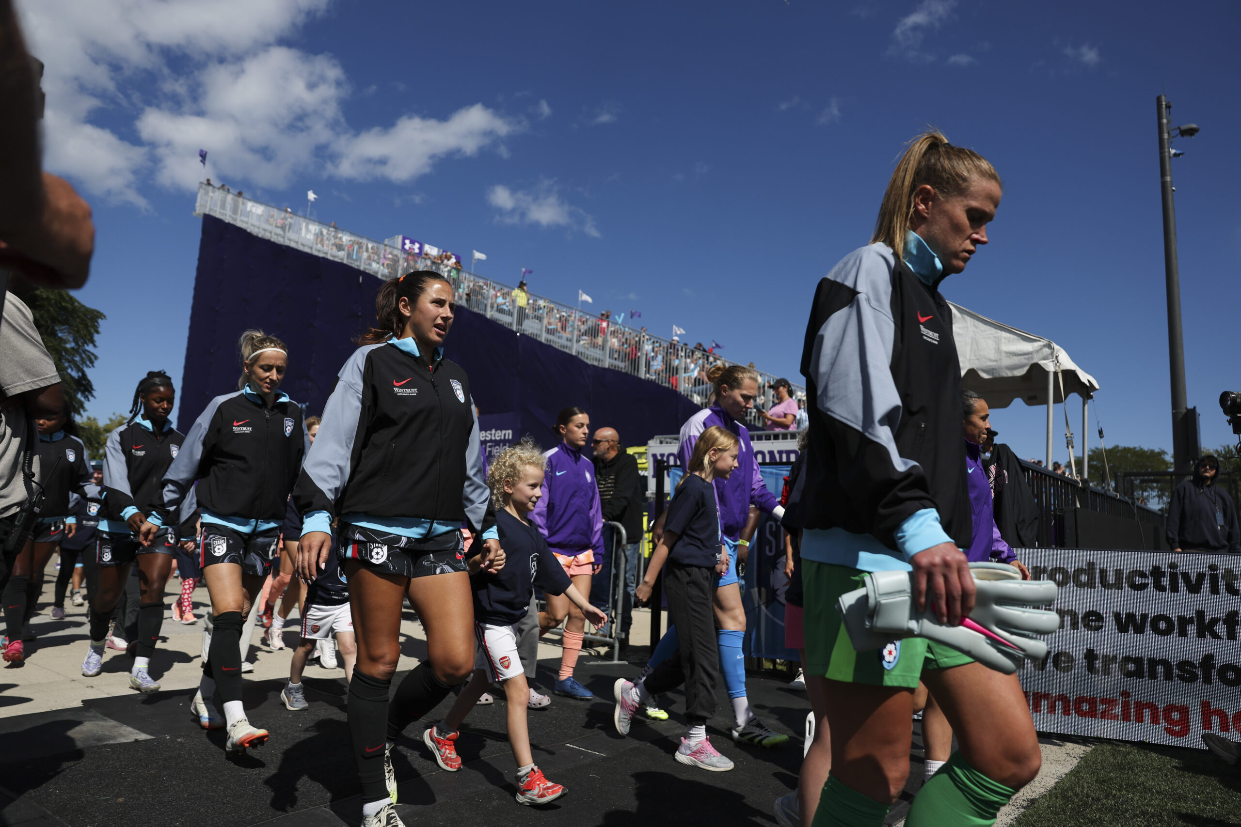 The Chicago StarsÂ and Orlando Pride players walk onto the field...