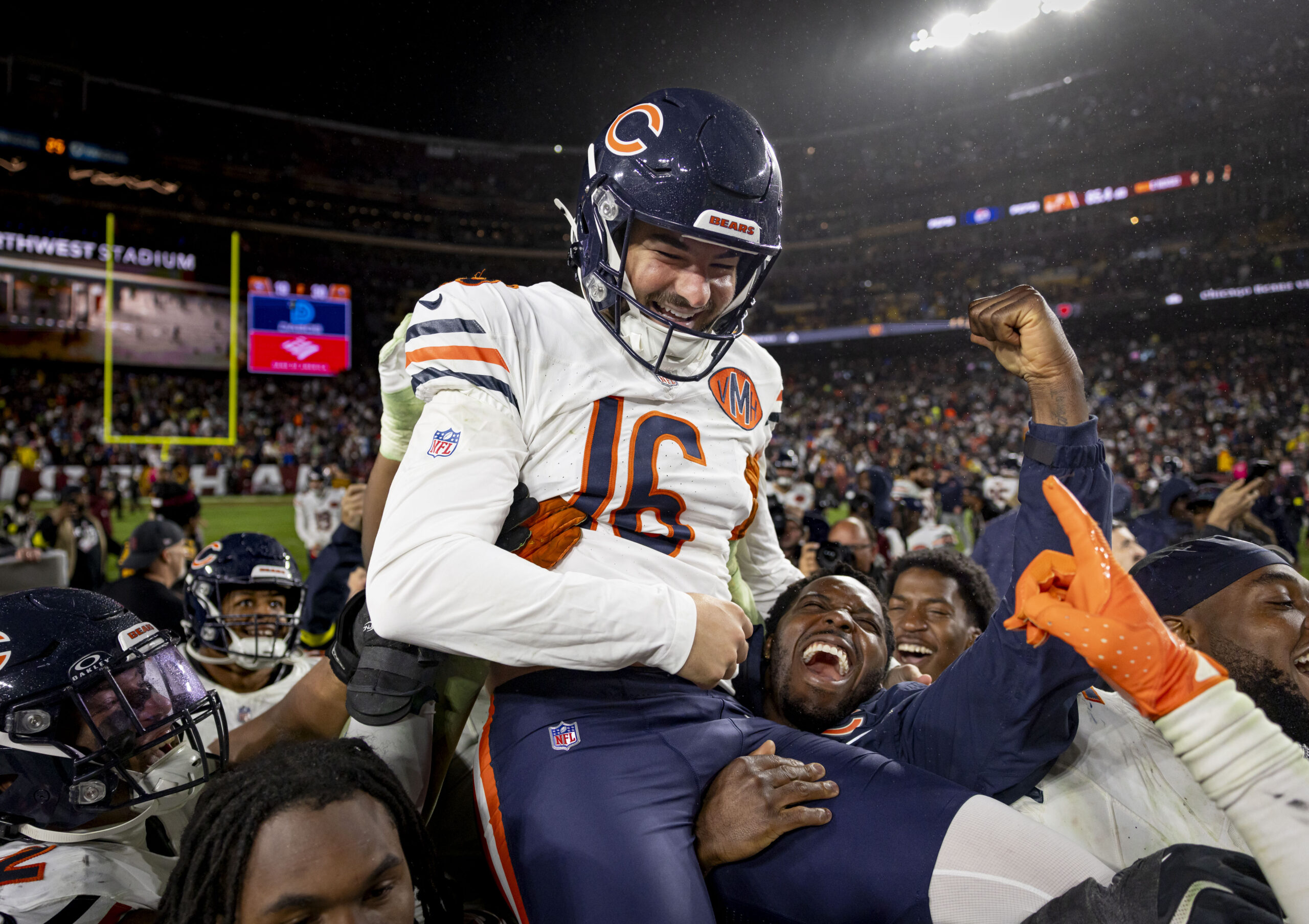 Oct. 13: Chicago Bears teammates hoist kicker Jake Moody as...