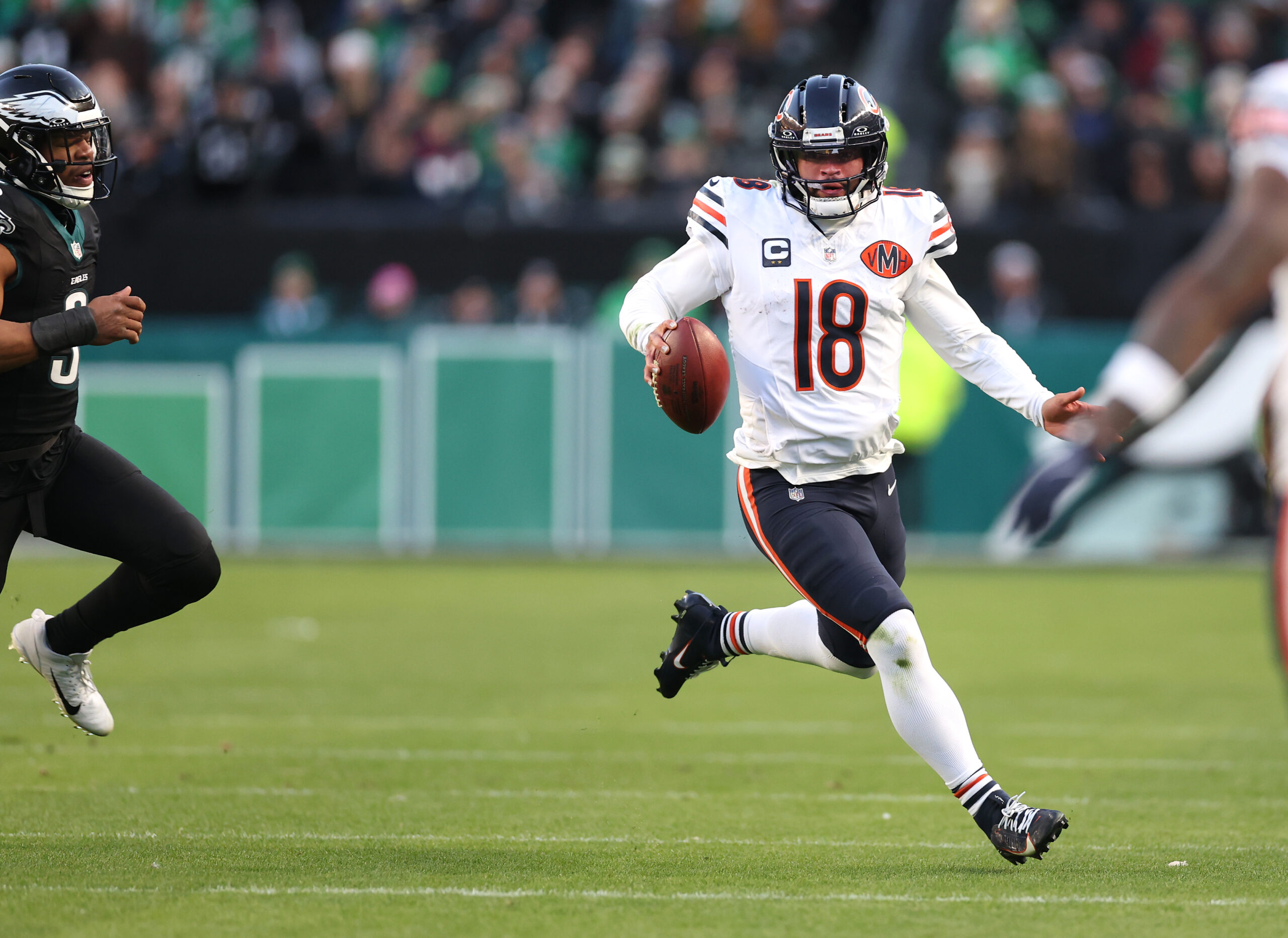 Chicago Bears quarterback Caleb Williams (18) takes off on a...