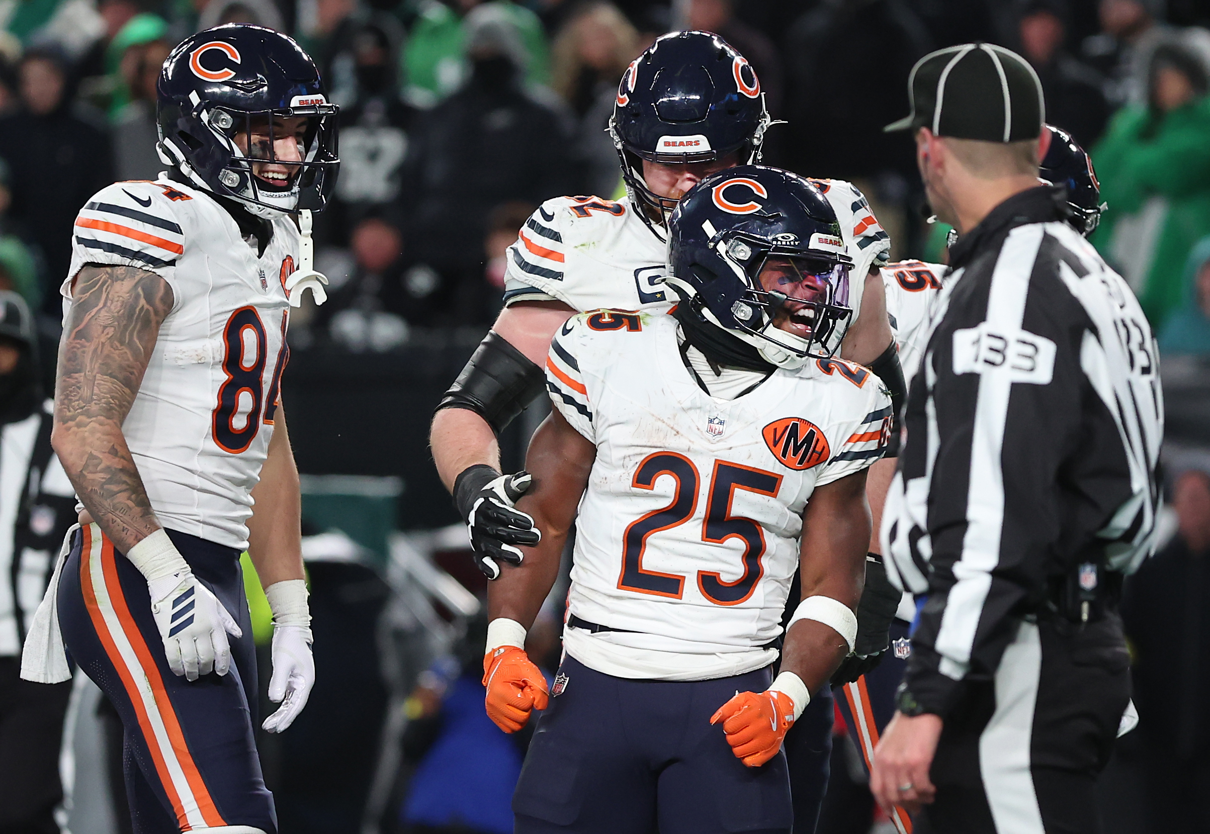 Chicago Bears running back Kyle Monangai (25) celebrates after scoring...