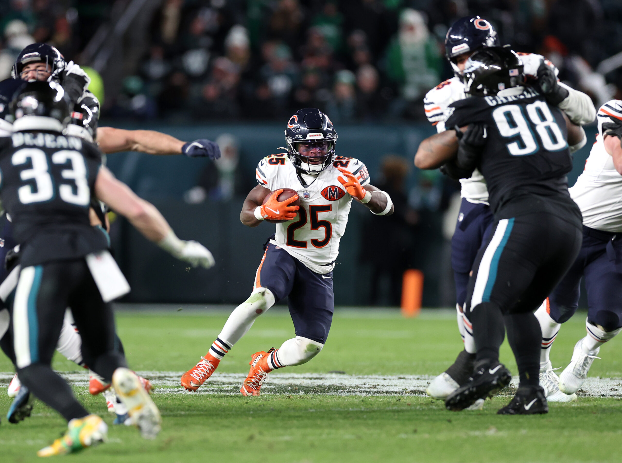 Chicago Bears running back Kyle Monangai (25) finds a hole...