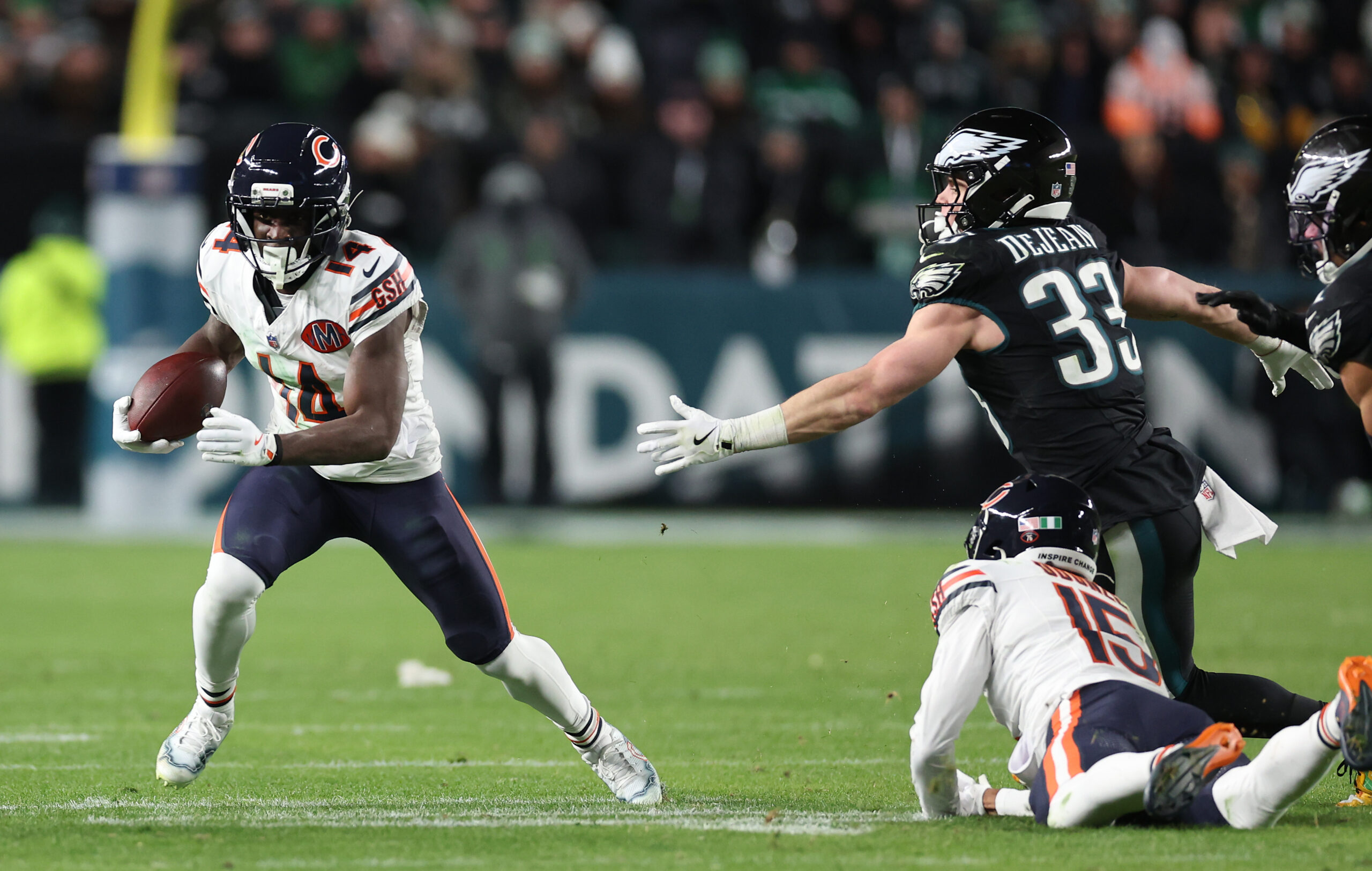 Chicago Bears wide receiver Olamide Zaccheaus (14) gains a first...