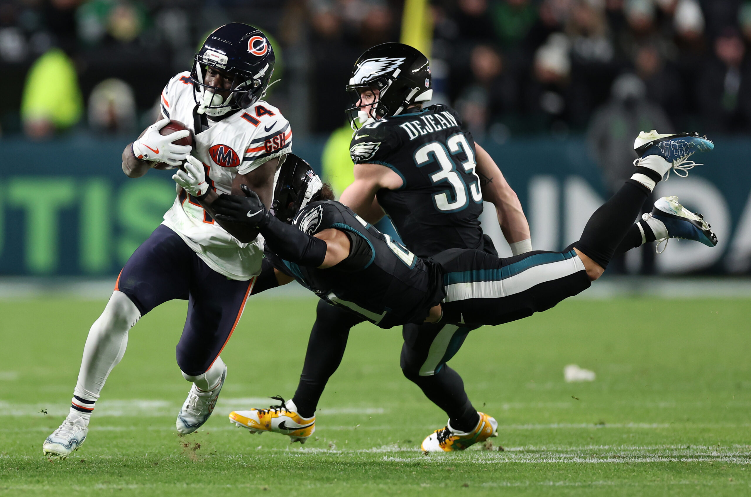 Chicago Bears wide receiver Olamide Zaccheaus (14) gains a first...