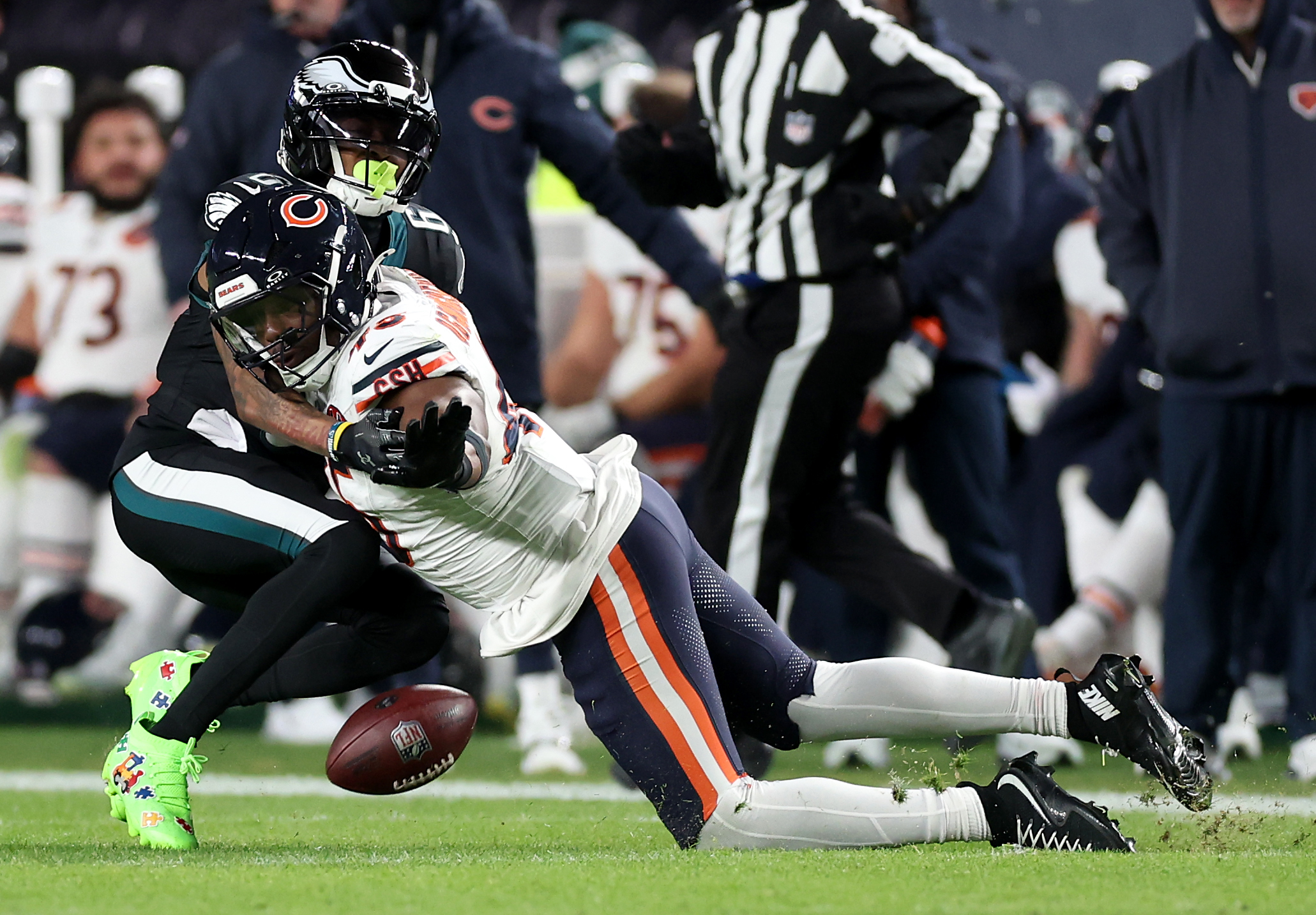 Chicago Bears linebacker Amen Ogbongbemiga (45) helps to break up...