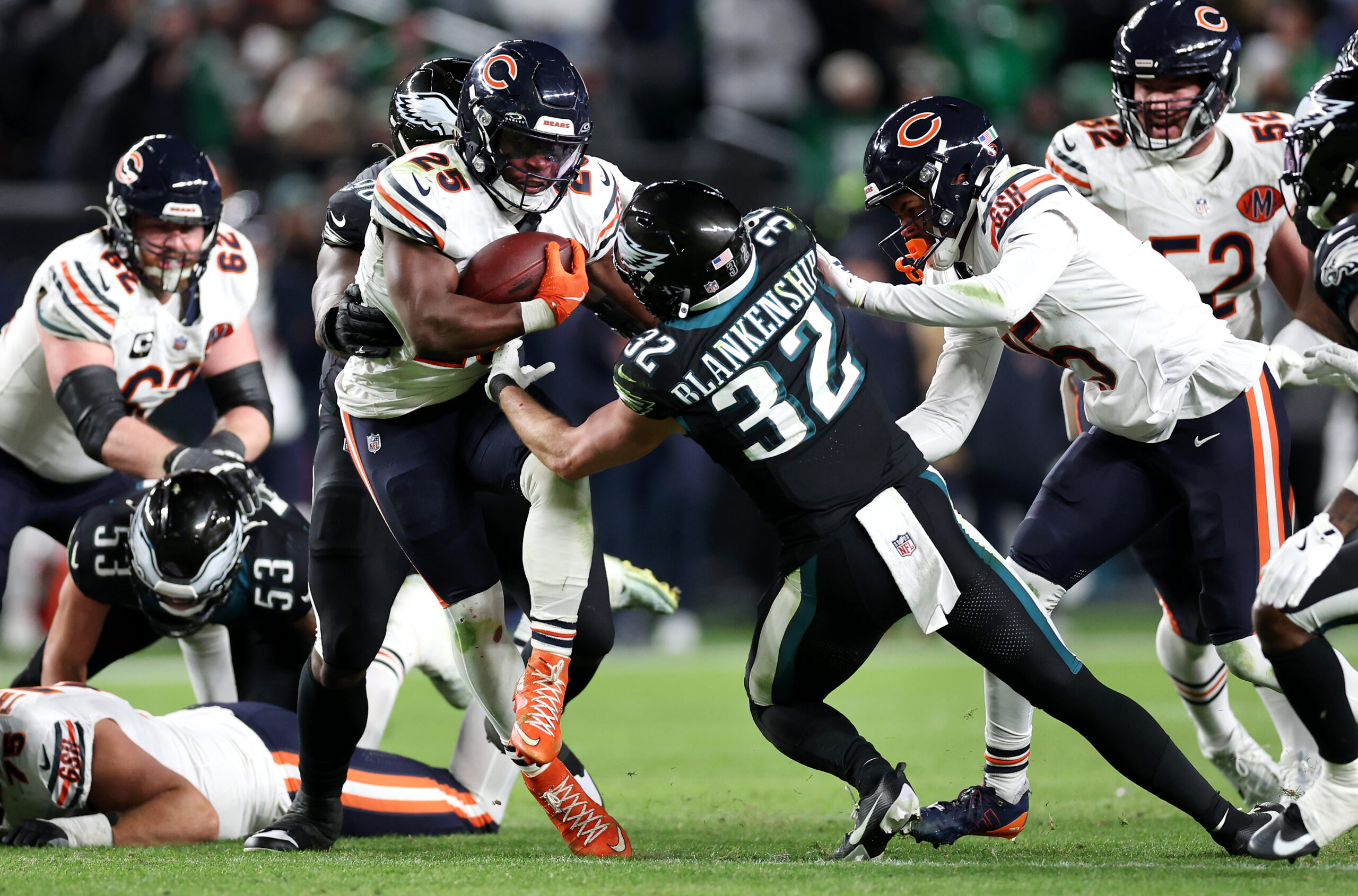 Chicago Bears running back Kyle Monangai (25) tries to break...
