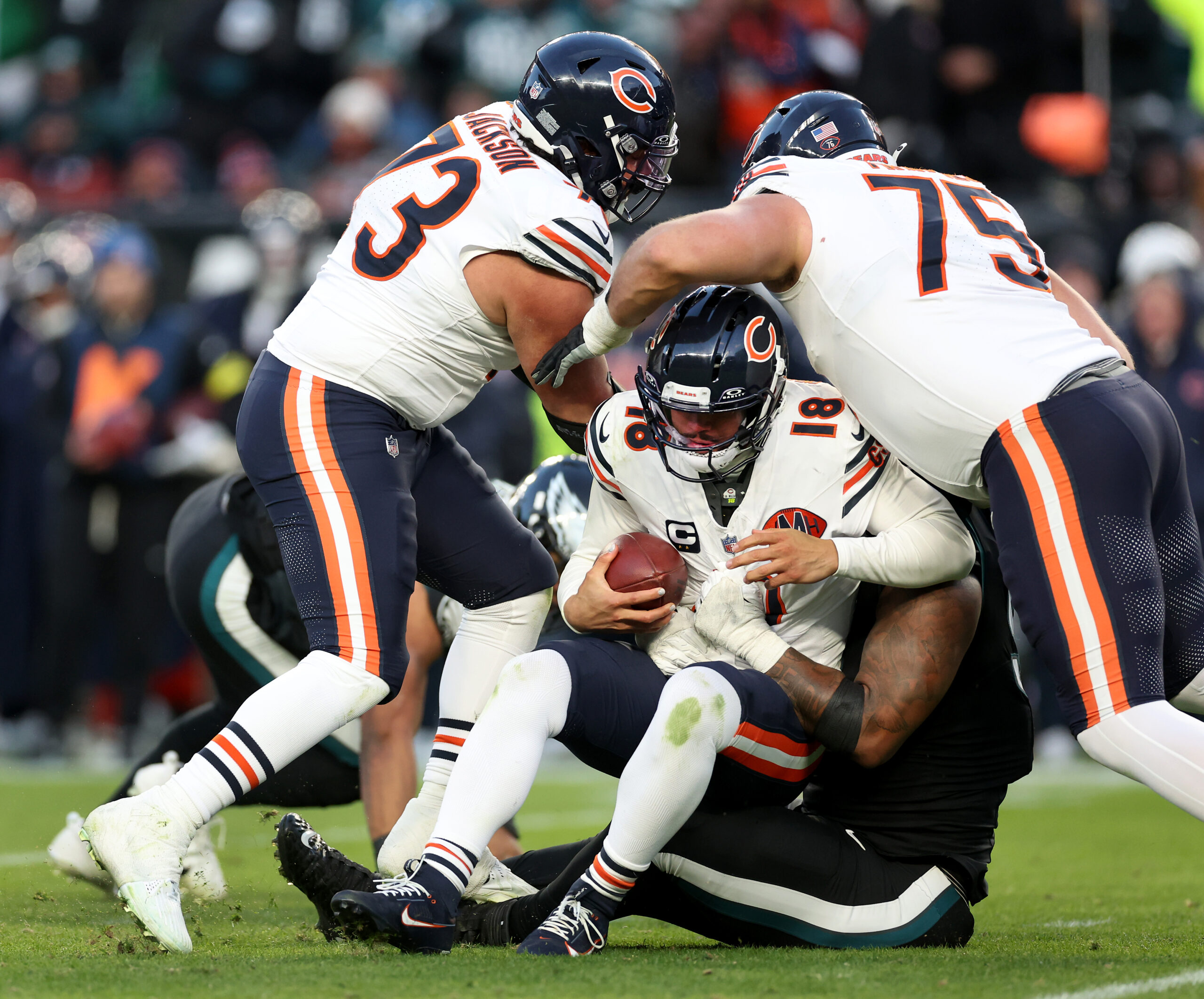 Chicago Bears quarterback Caleb Williams (18) is sacked by Philadelphia...