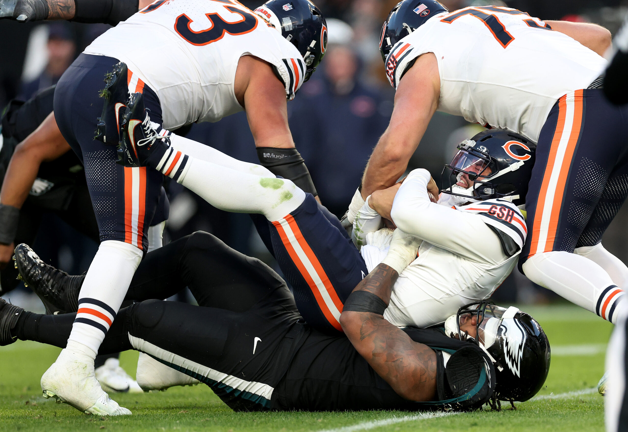 Chicago Bears quarterback Caleb Williams (18) is sacked by Philadelphia...