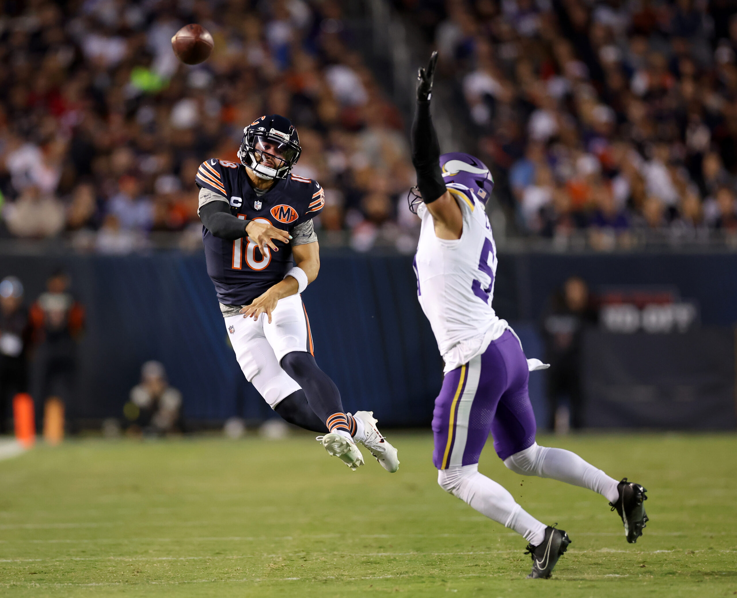 Bears quarterback Caleb Williams throws a pass for a first...