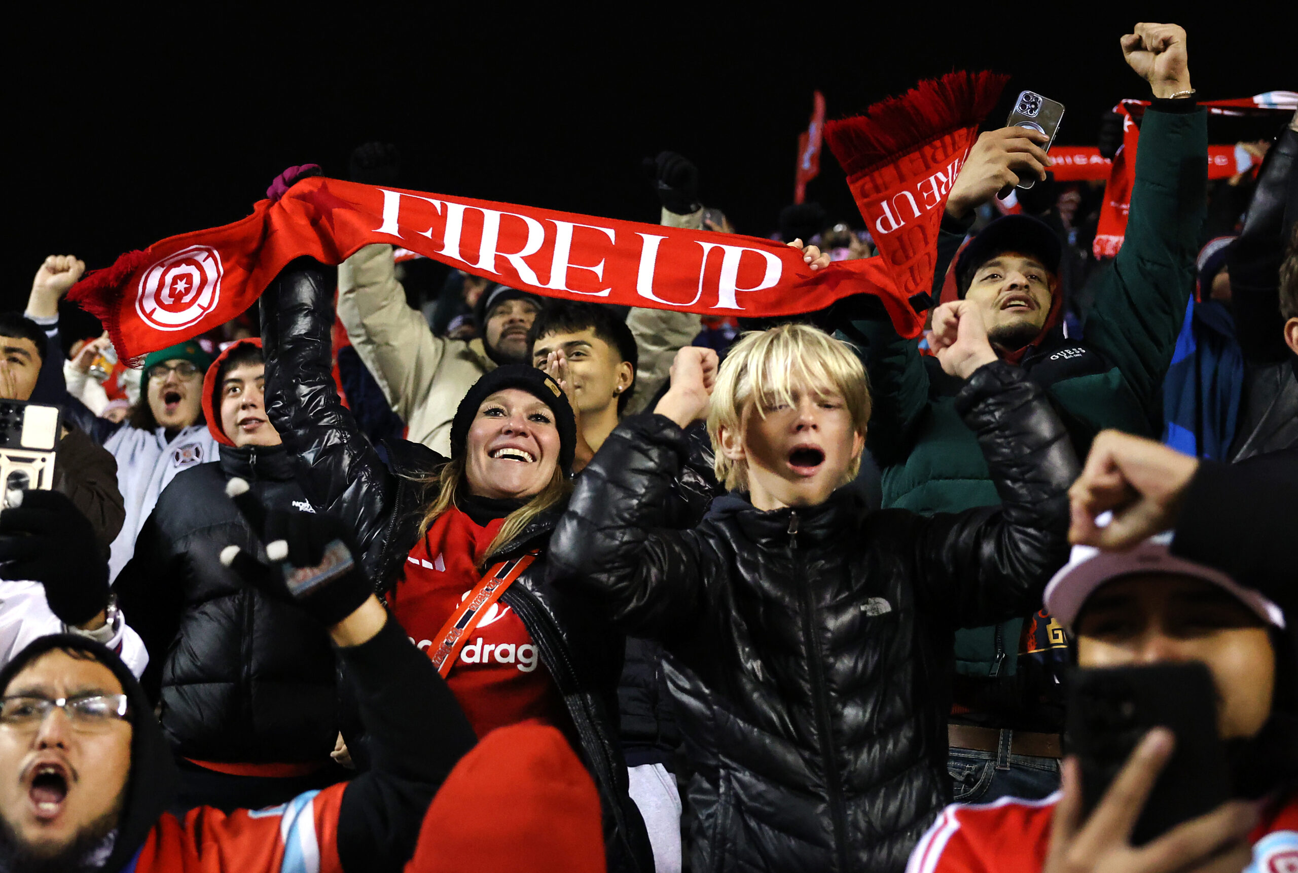 Chicago Fire fans celebrate after the team's 3-1 victory over...