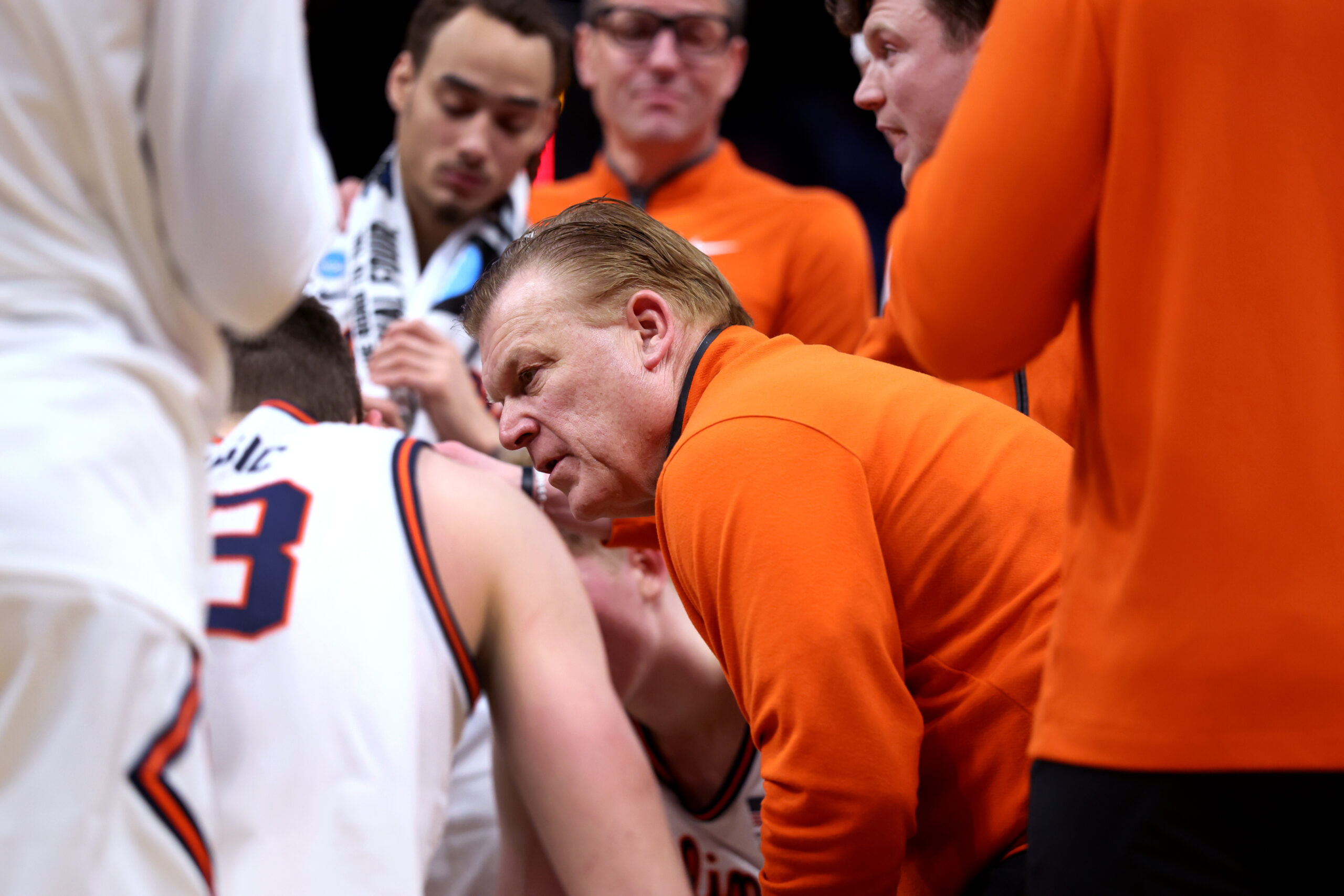 Illinois coach Brad Underwood talks to his players during a...