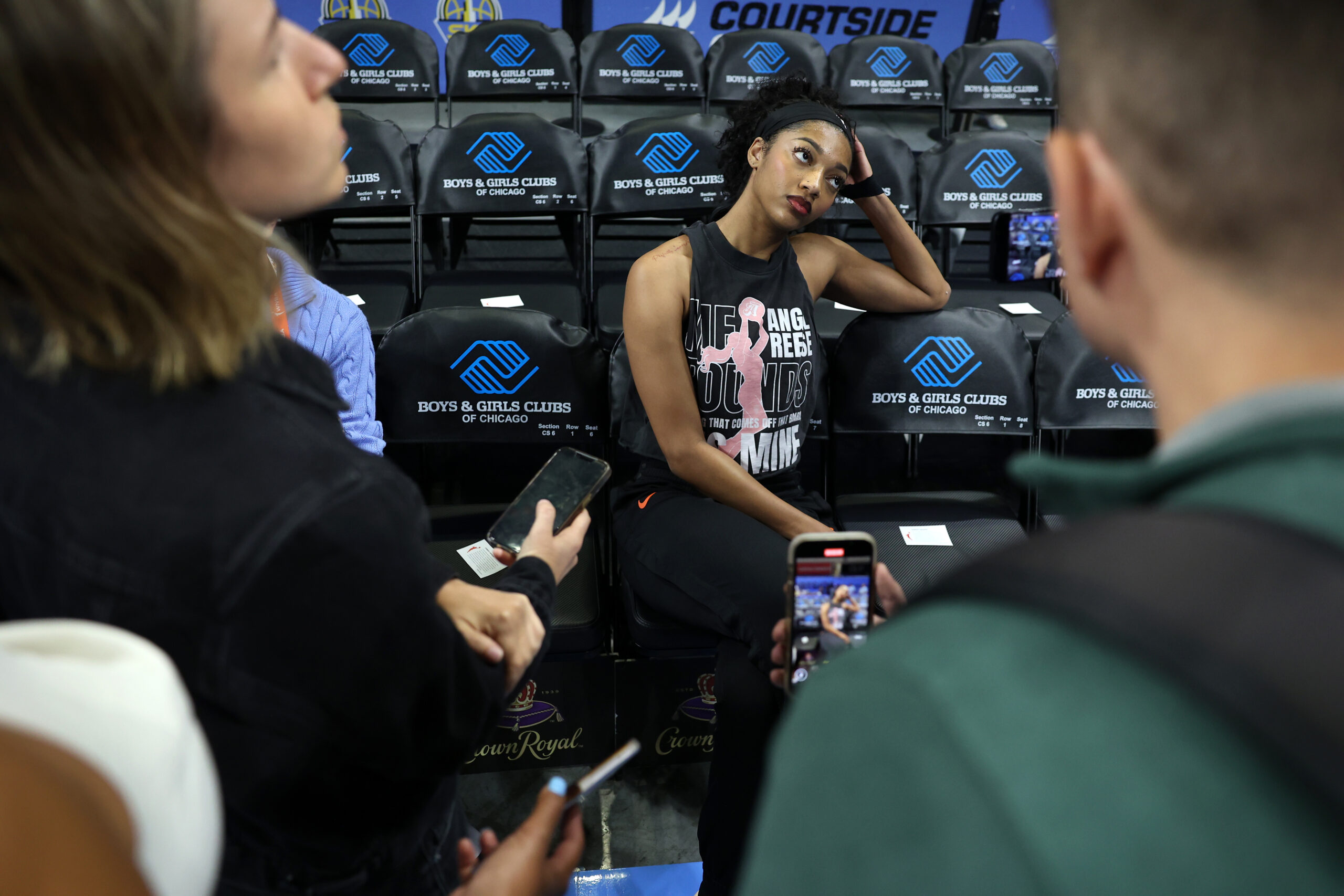 Chicago Sky forward Angel Reese chats with members of the...