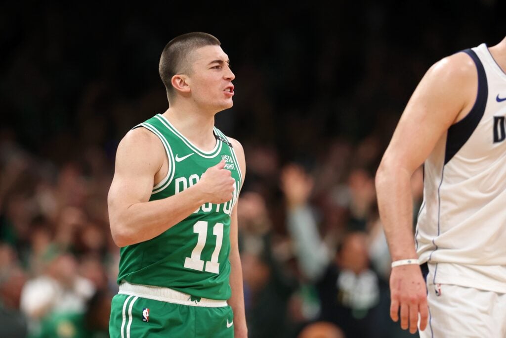 Jun 17, 2024; Boston, Massachusetts, USA; Boston Celtics guard Payton Pritchard (11) reacts after making a half-court shot at the buzzer to end the second quarter in game five of the 2024 NBA Finals at TD Garden. Mandatory Credit: Peter Casey-USA TODAY Sports