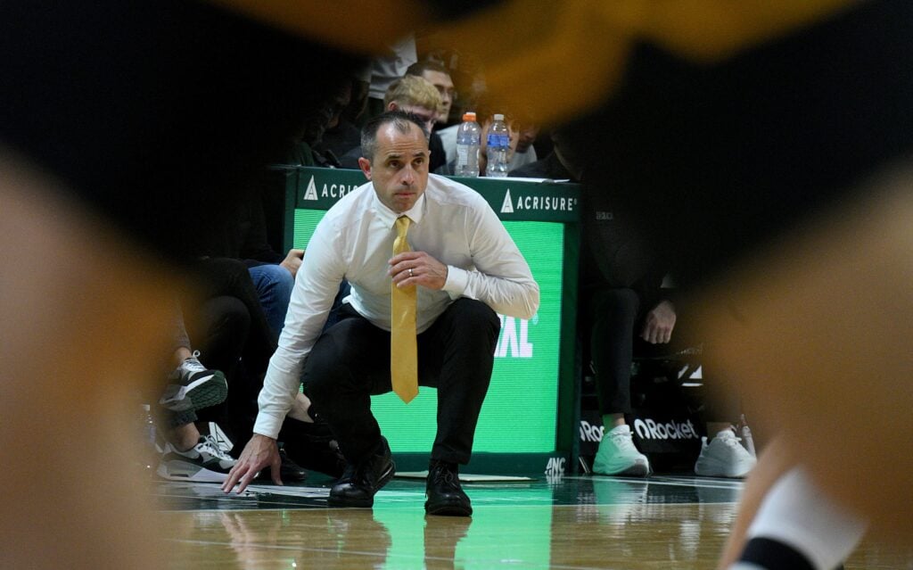 Iowa Hawkeyes head coach Ben McCollum watches play against the Michigan State Spartans at Jack Breslin Student Events Center.