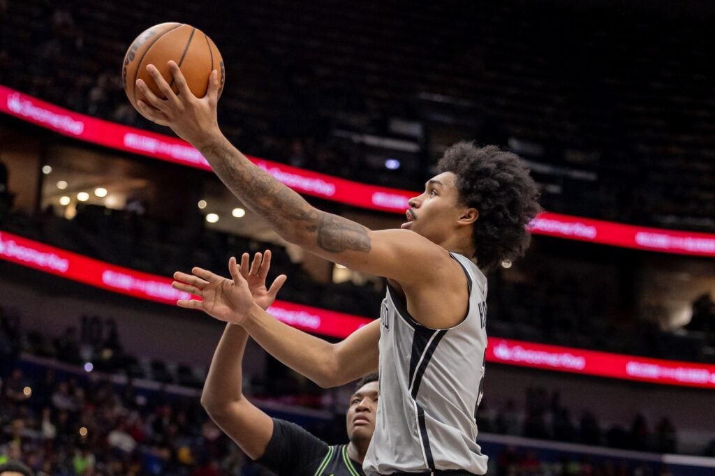 San Antonio Spurs guard Dylan Harper (2) drives to the basket against New Orleans Pelicans center Derik Queen (22) during the first half at Smoothie King Center.