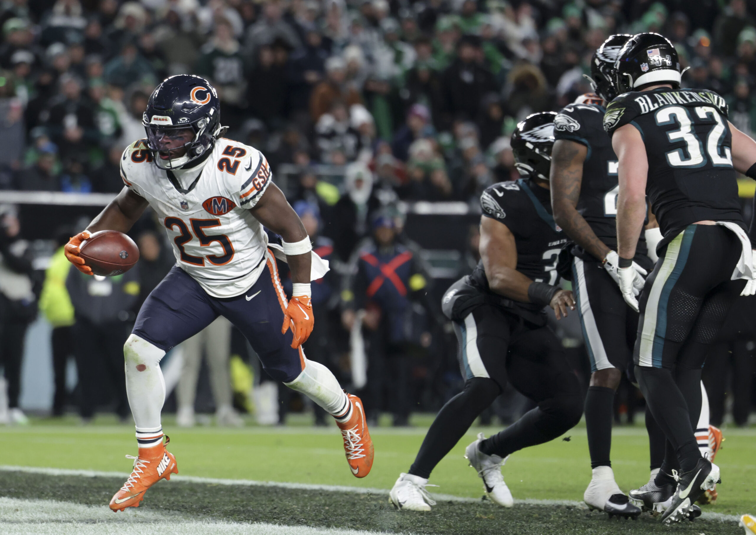 Chicago Bears running back Kyle Monangai scores a touchdown against...