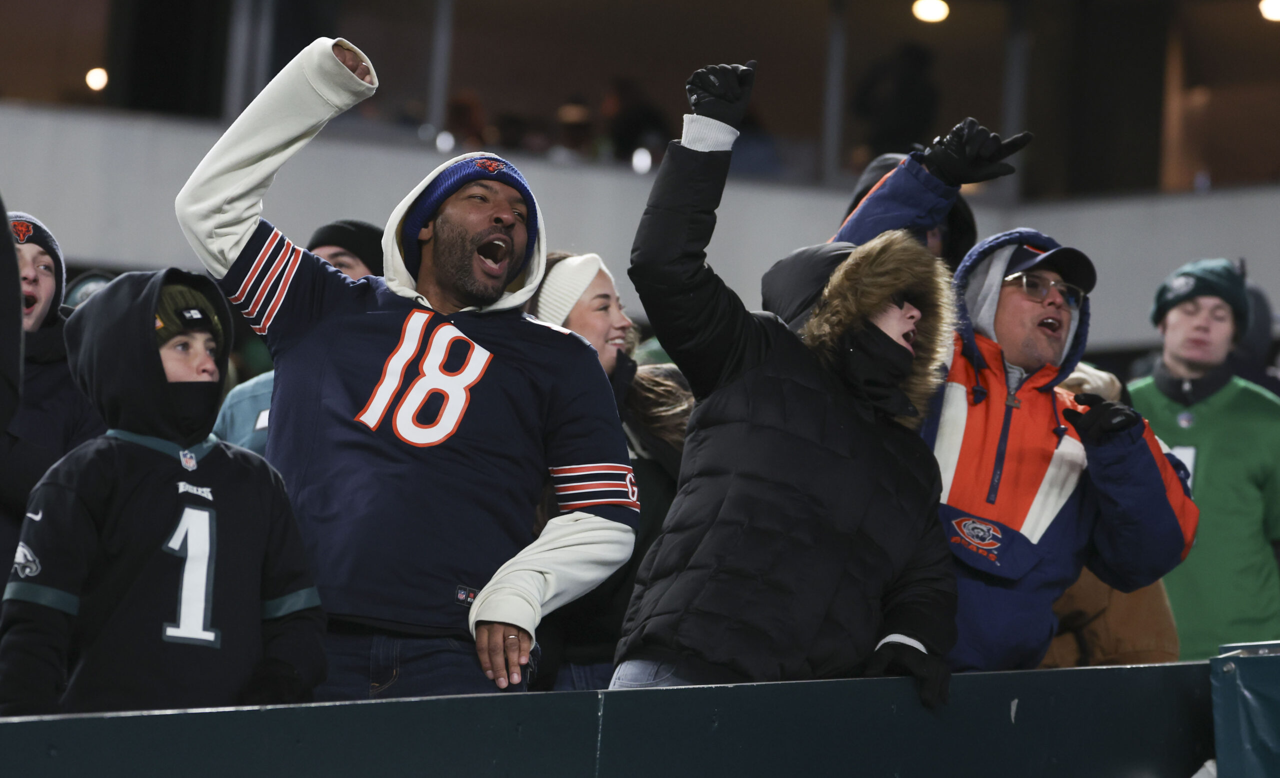 Bears fans celebrate in the fourth quarter against the Eagles...