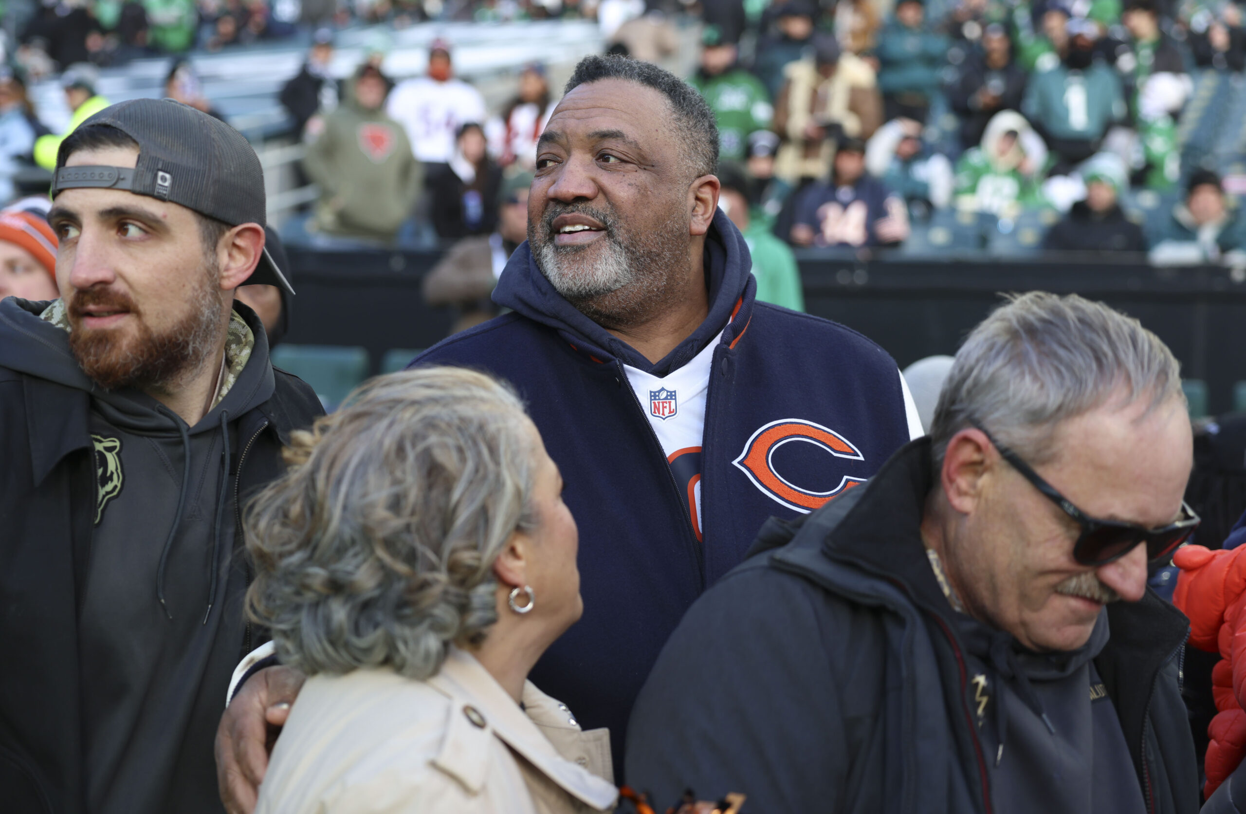Carl Williams watches his son, Bears quarterback Caleb Williams, warm...